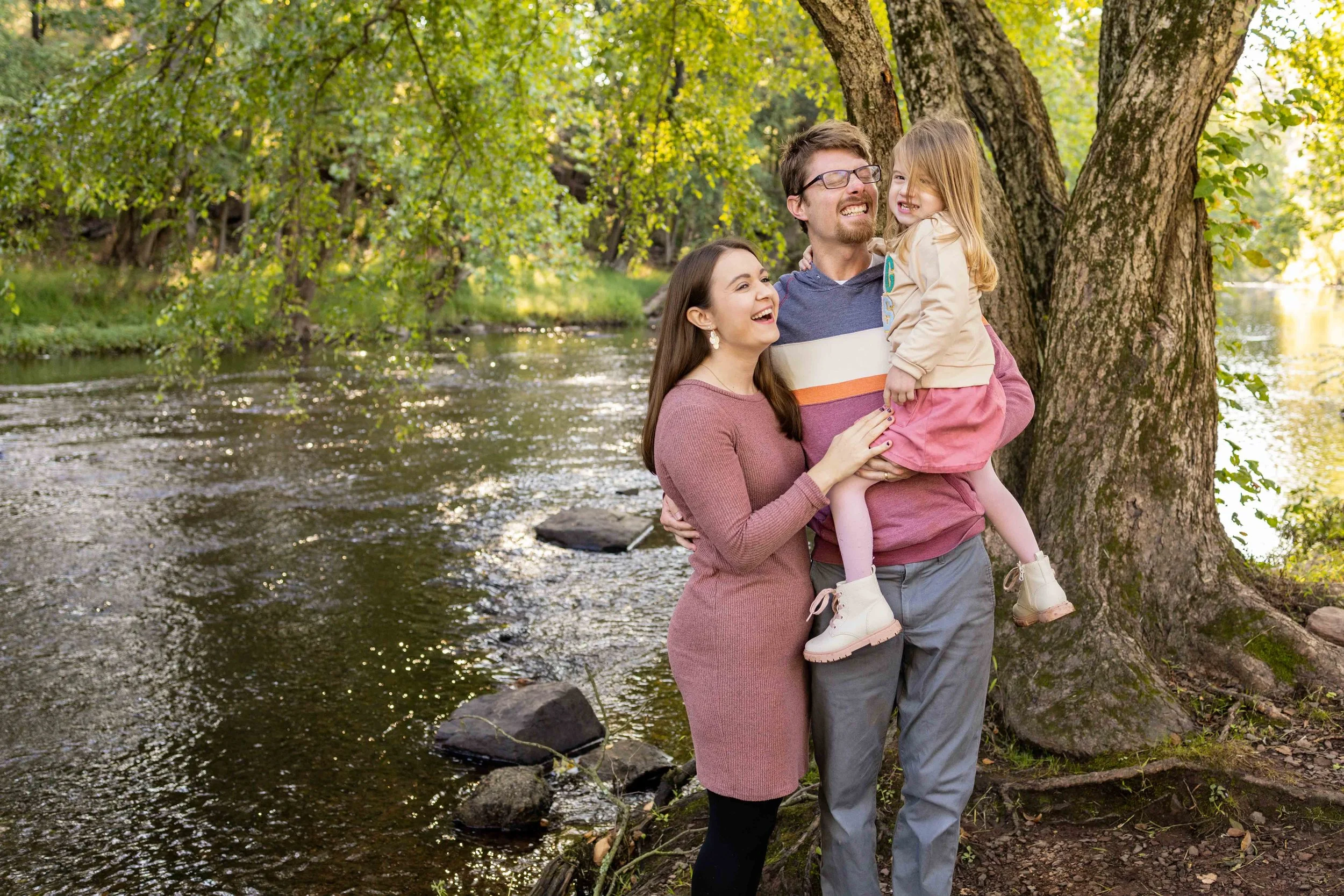 Parents tickle their daughter and laugh together - taken in Hunterdon County, NJ by Jennifer Fulton Photography
