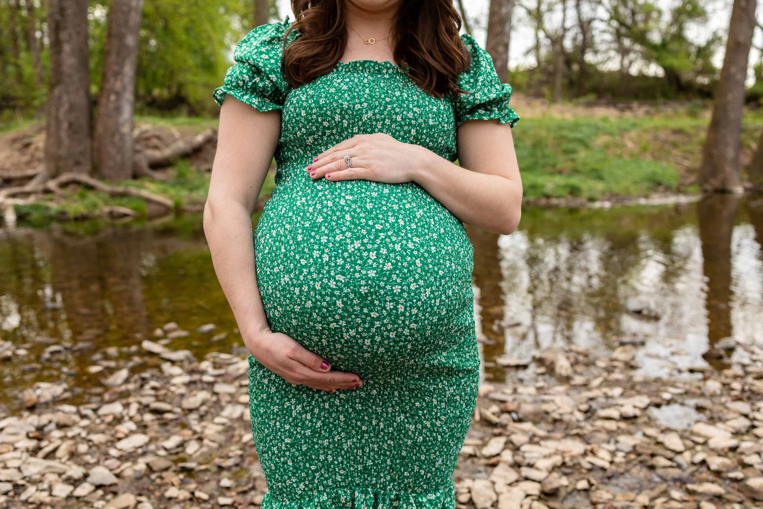A pregnant mom holds her belly - maternity portrait taken by Jennifer Fulton Photography in Central New Jersey
