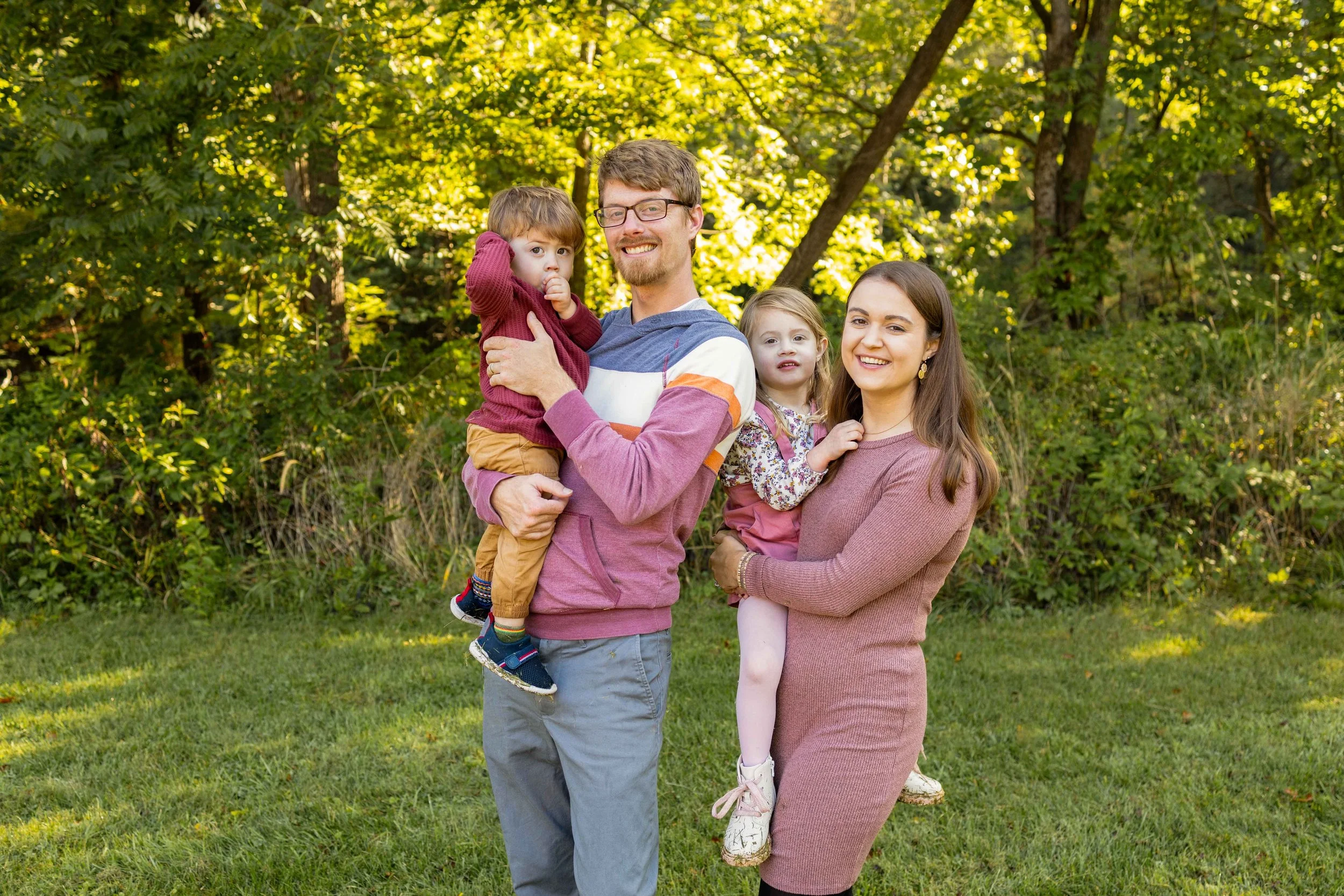 A young family stands together in a field - taken in Hunterdon County, New Jersey by Jennifer Fulton Photography