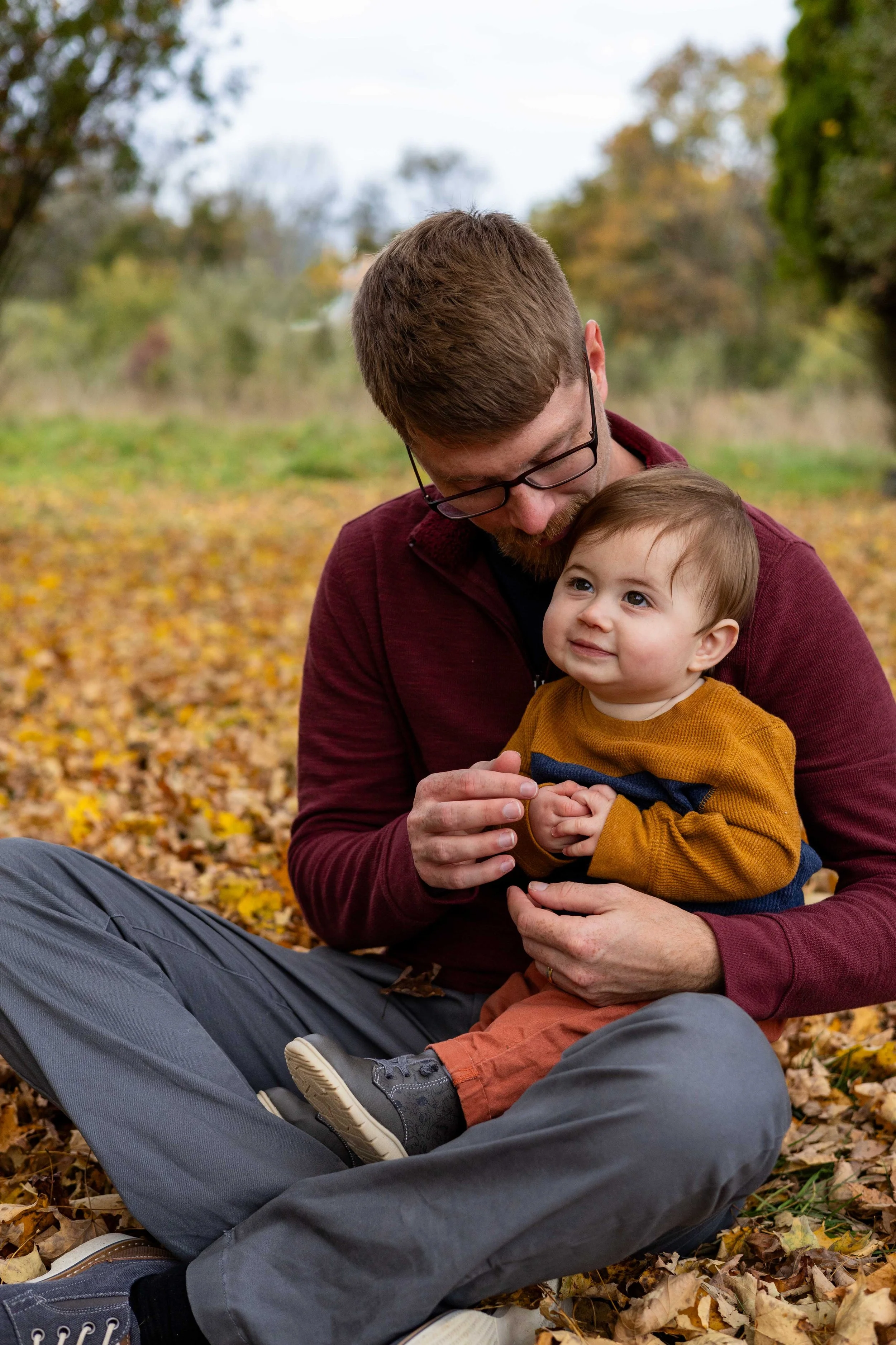 A father sits and cuddles with his son - taken in Hunterdon County, NJ by Jennifer Fulton Photography
