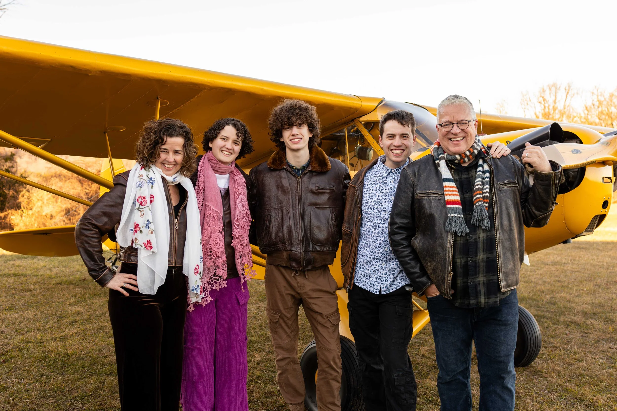 A family stands in front of their antique yellow plane - taken in Bucks County, Pennsylvania by Jennifer Fulton Photography