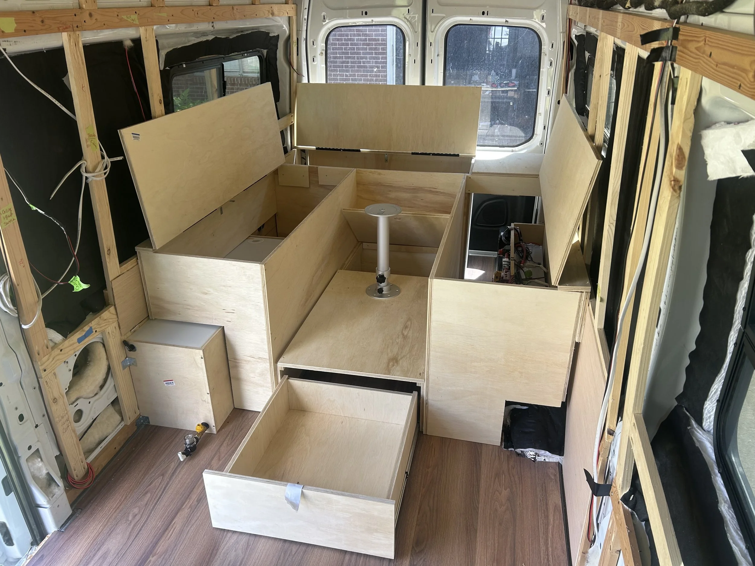 Dinette and bed area with plenty of storage.