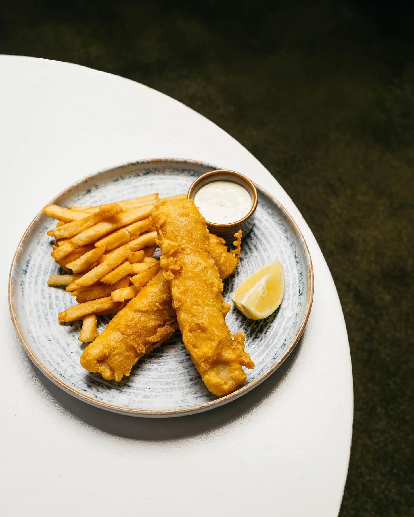 Sun&rsquo;s out, temps are up &mdash; time for the staple post beach meal: Beer Battered Fish &amp; Chips. With golden hoki fillet, fries, tartare, lemon. Nothing beats it.