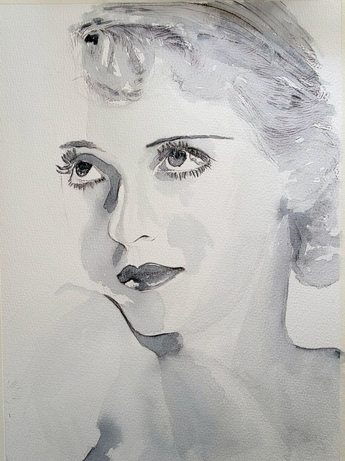 Bette Davis – This delicate grayscale portrait highlights Davis’s luminous eyes and quiet poise, reflecting the allure of Old Hollywood glamour.