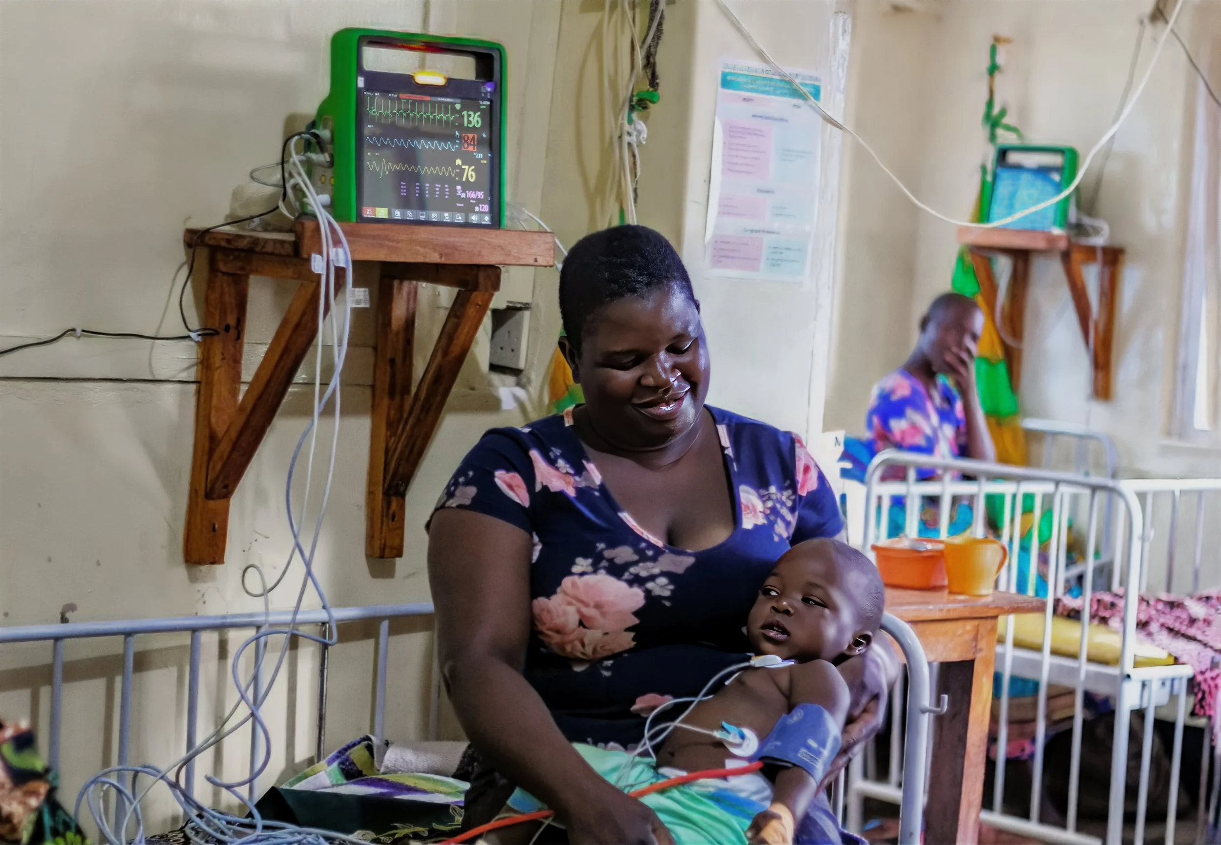 A mother with a newborn attached to Impala Uzazi