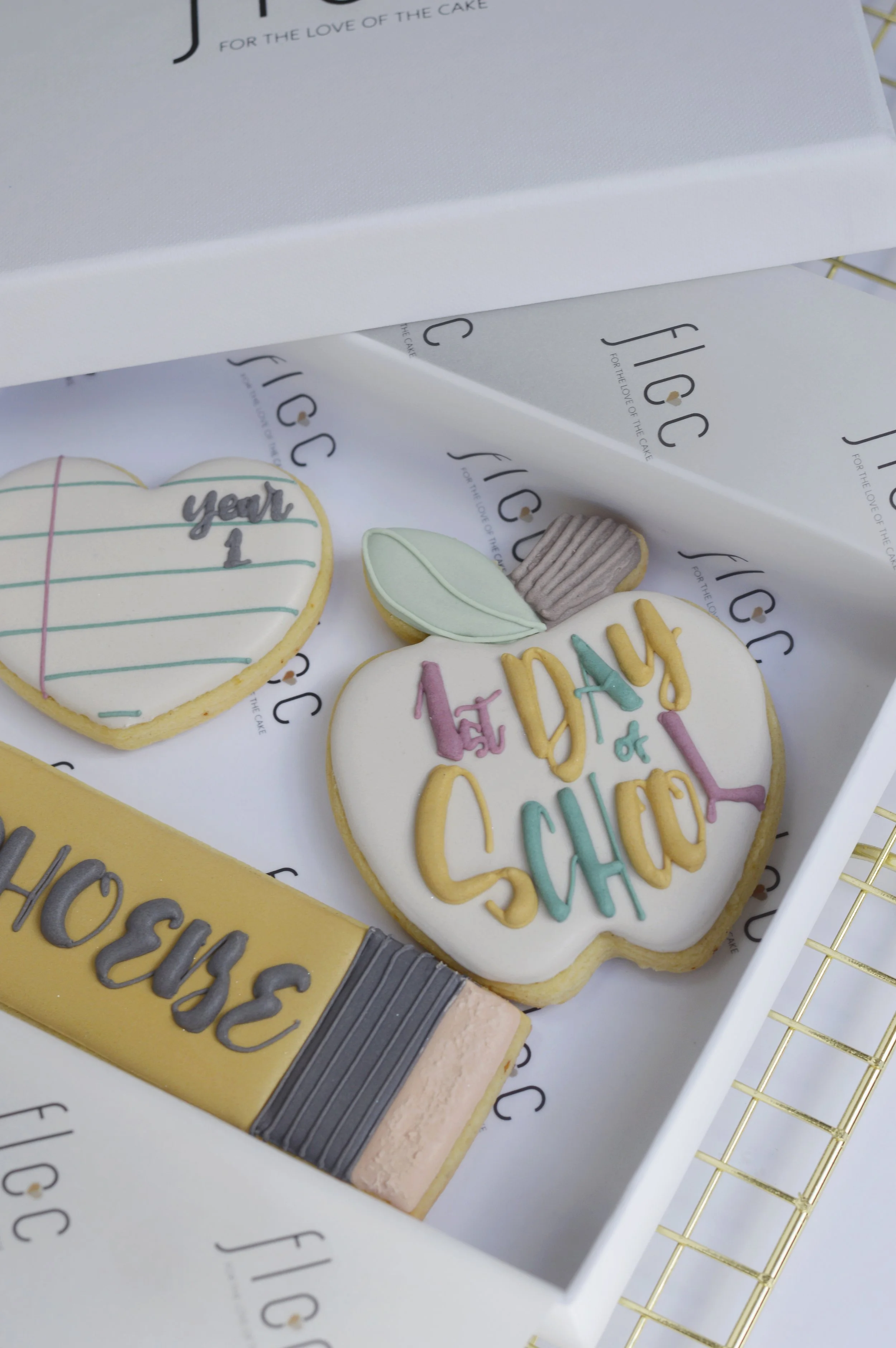 Personalised First Day of School cookie set with Year 1 heart cookie and hand-piped apple cookie reading "1st Day of School"
