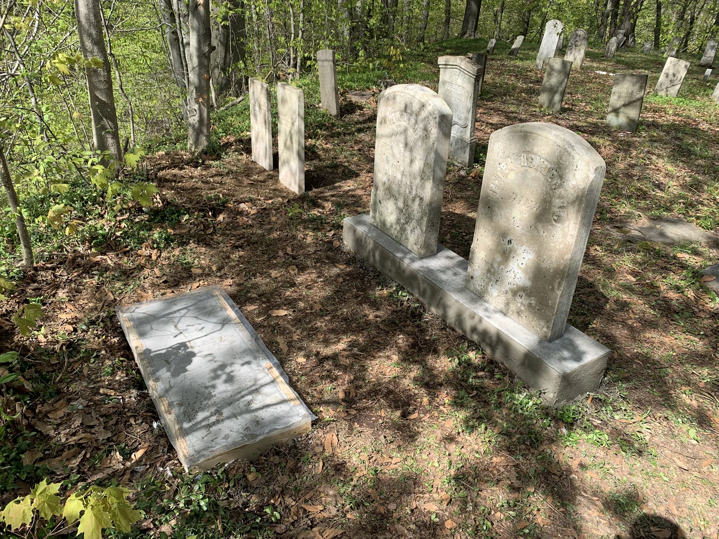 Tipped over gravestone monuments in Central New York