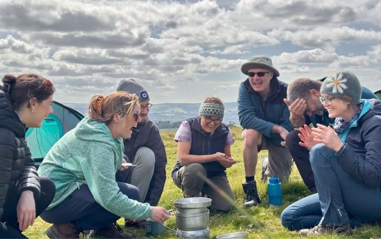Cooking dinner outdoors on a wilderness expedition.