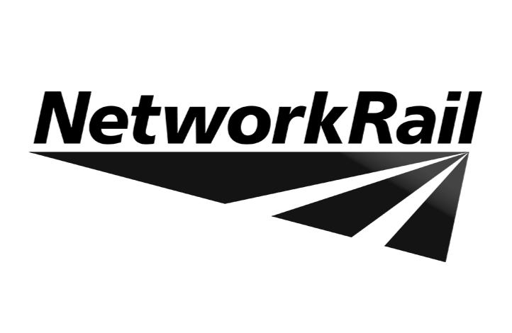 Black paper airplane with a contrail effect, pointing to the right, against a white background.