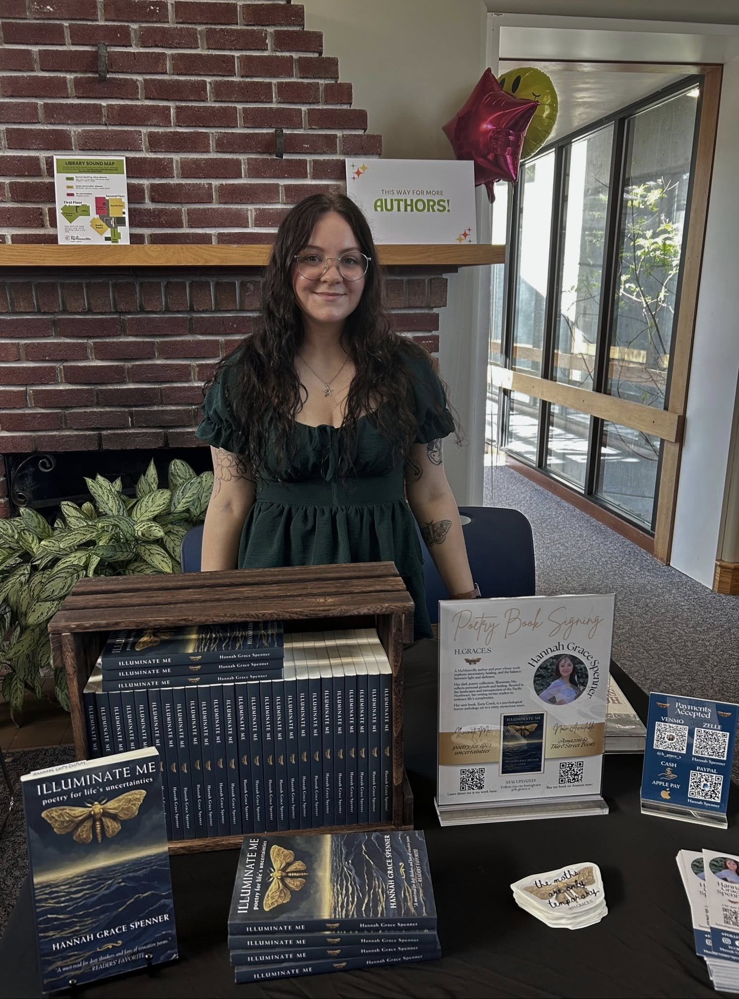 Hannah Spenner at the McMinnville Author Fair, selling Illuminate Me poetry book.