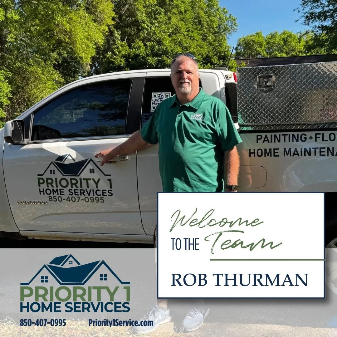 Rob Thurman standing in front of a Priority 1 Home Services truck with a welcome to the team sign