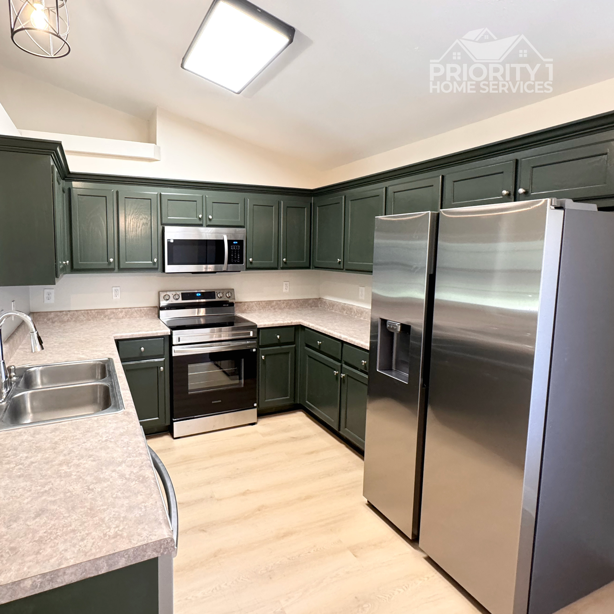 Kitchen cabinet painting project in Milton, Florida by Priority 1 Home Services