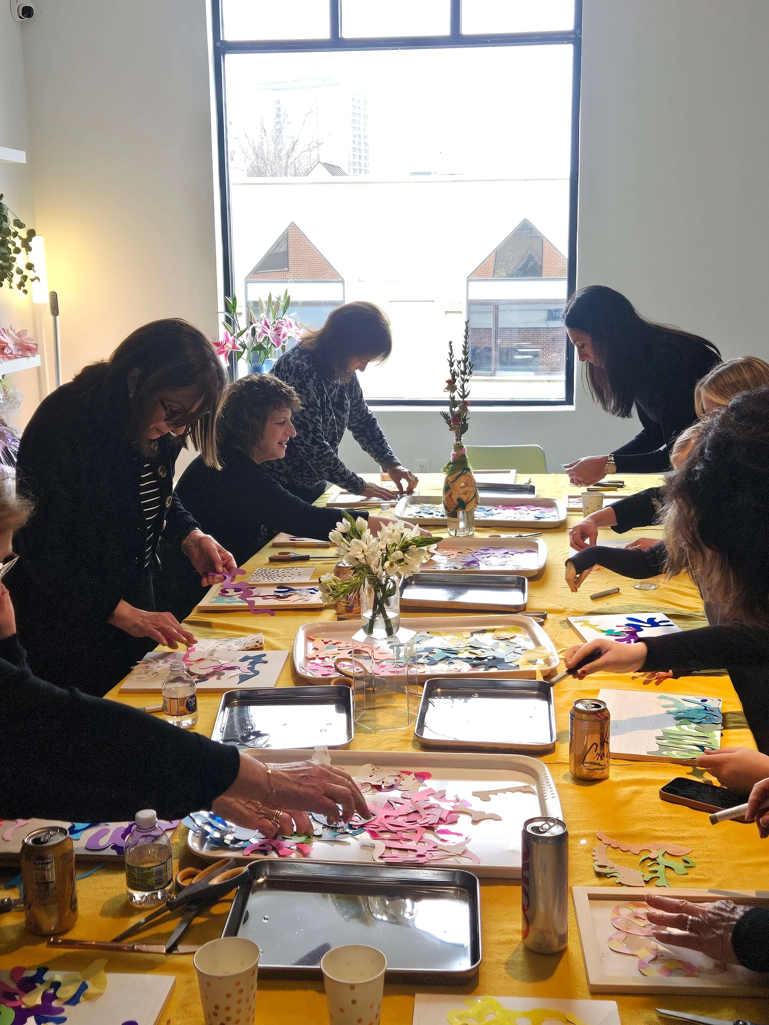 Group of adults enjoying a guided art workshop during a birthday party in Fort Lee New Jersey