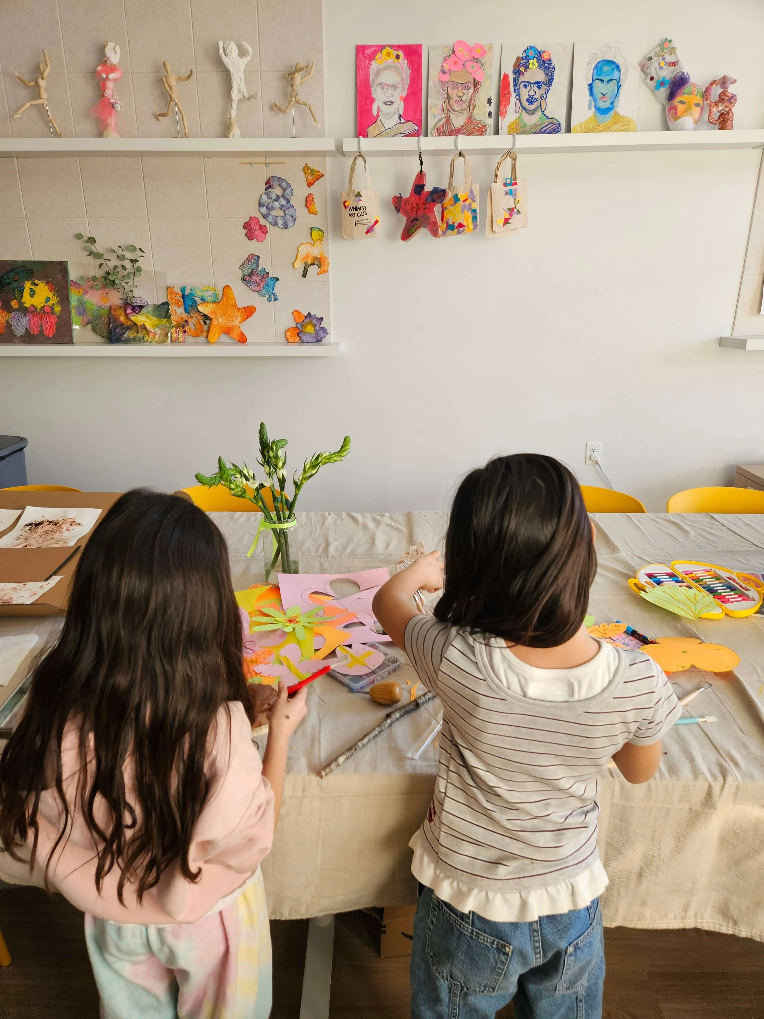 Children creating colorful paper crafts during a kids art class at Whimsy Art Club studio in Fort Lee, NJ.