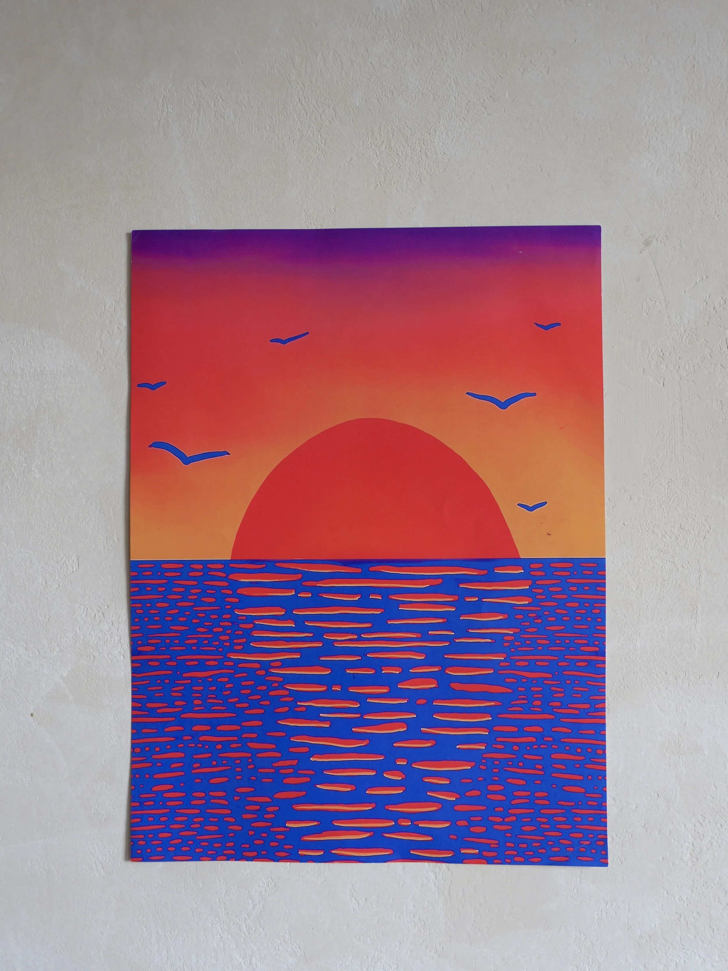 A vibrant painting depicting a sunset over the ocean with a large red sun setting on the horizon. The sky transitions from purple to orange. Several blue birds are flying in the sky. The ocean is illustrated with blue and orange horizontal lines, creating a stylized reflection of the sunset.