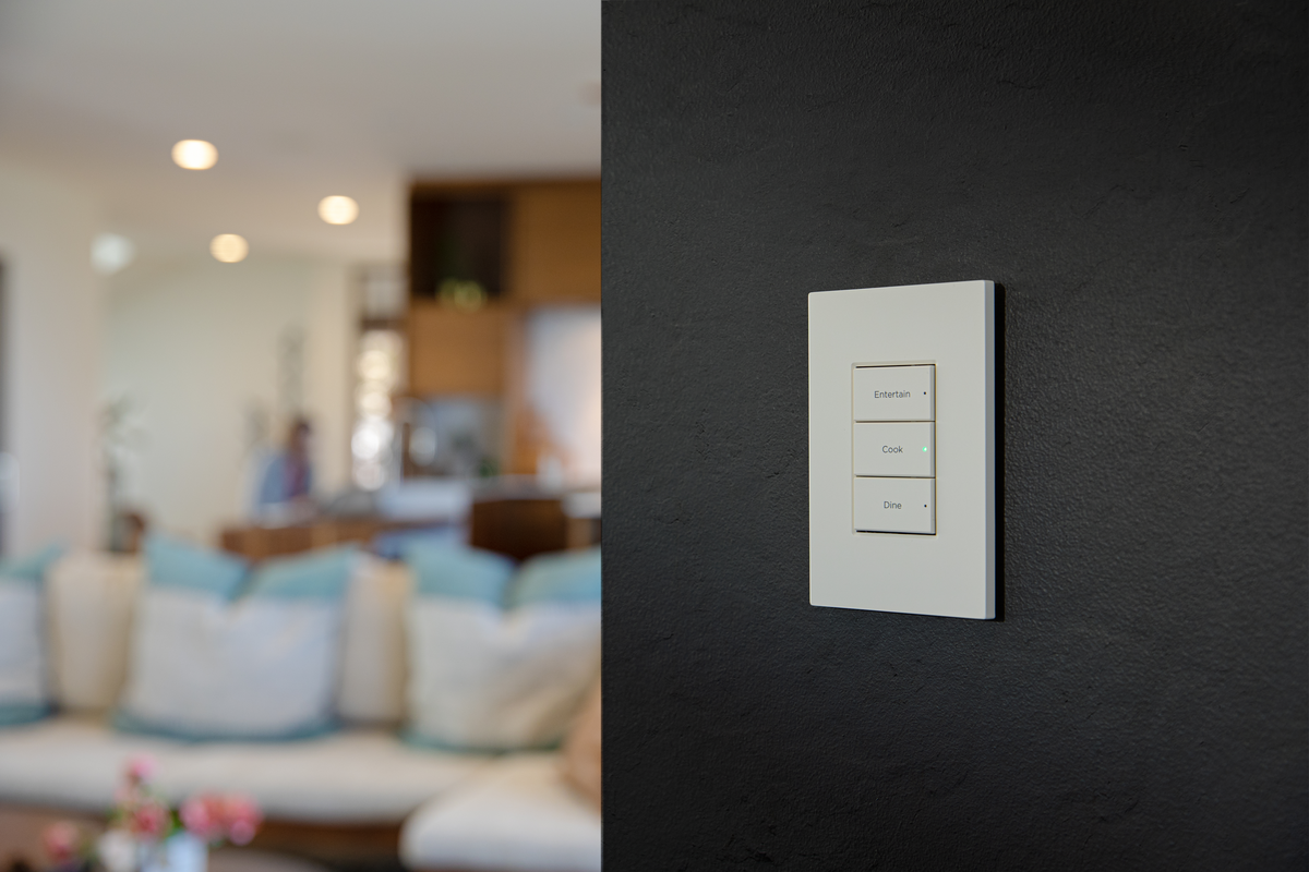 Control4 customizable smart home keypad with engraved buttons for effortless lighting, music, and scene control.