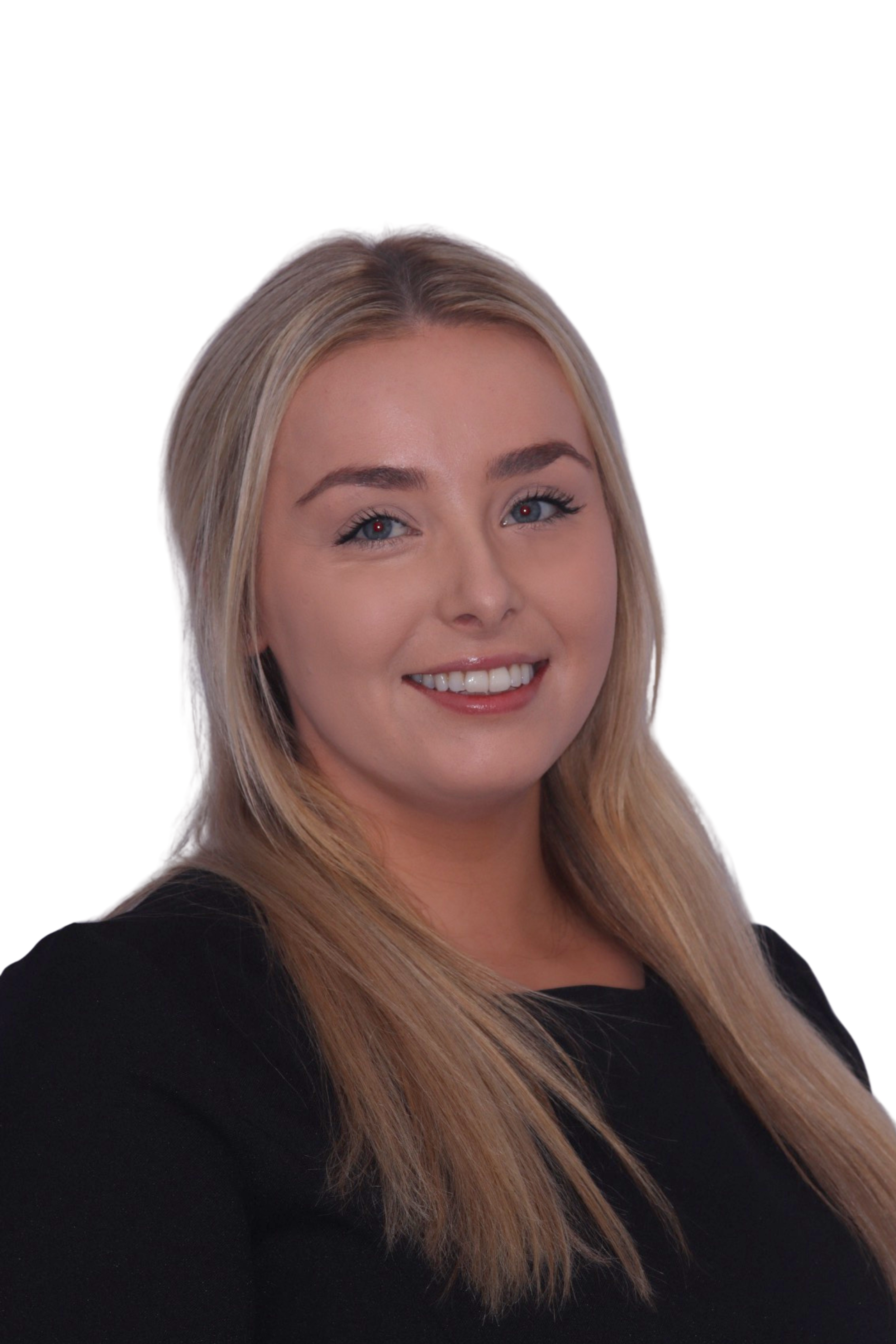 Smiling person in medical scrubs, light background