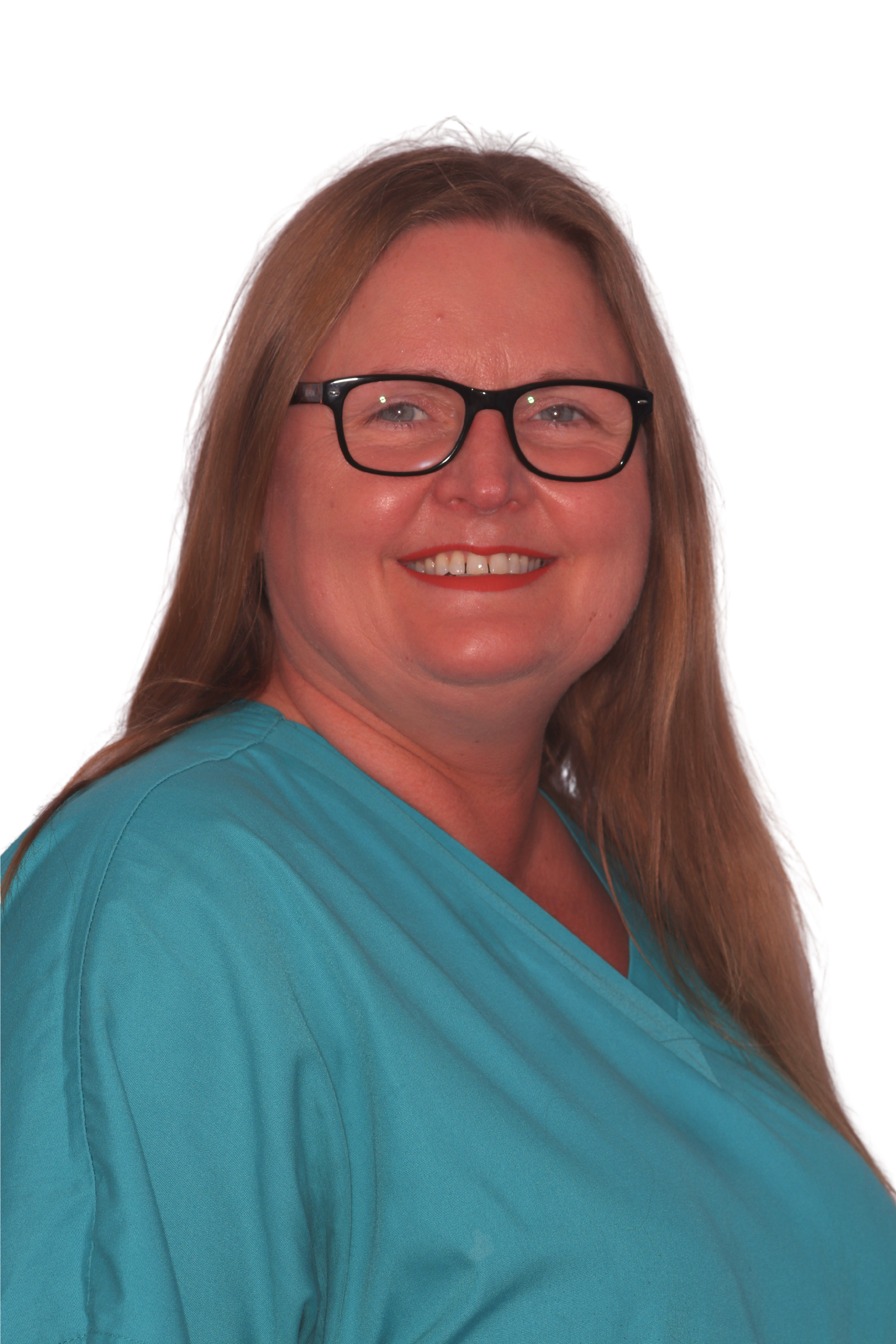 Person with long hair and glasses smiling