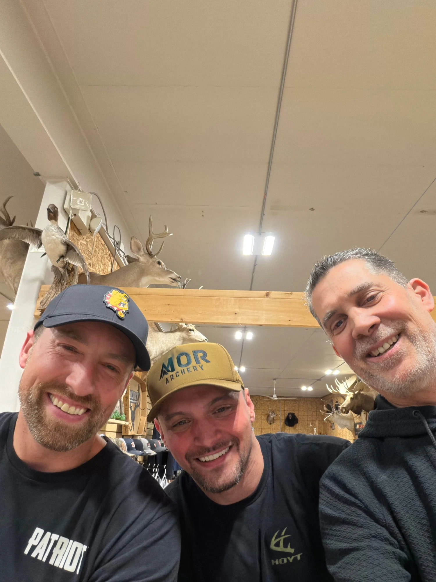 Kip and AJ with MOR Archery founder Tim inside the shop