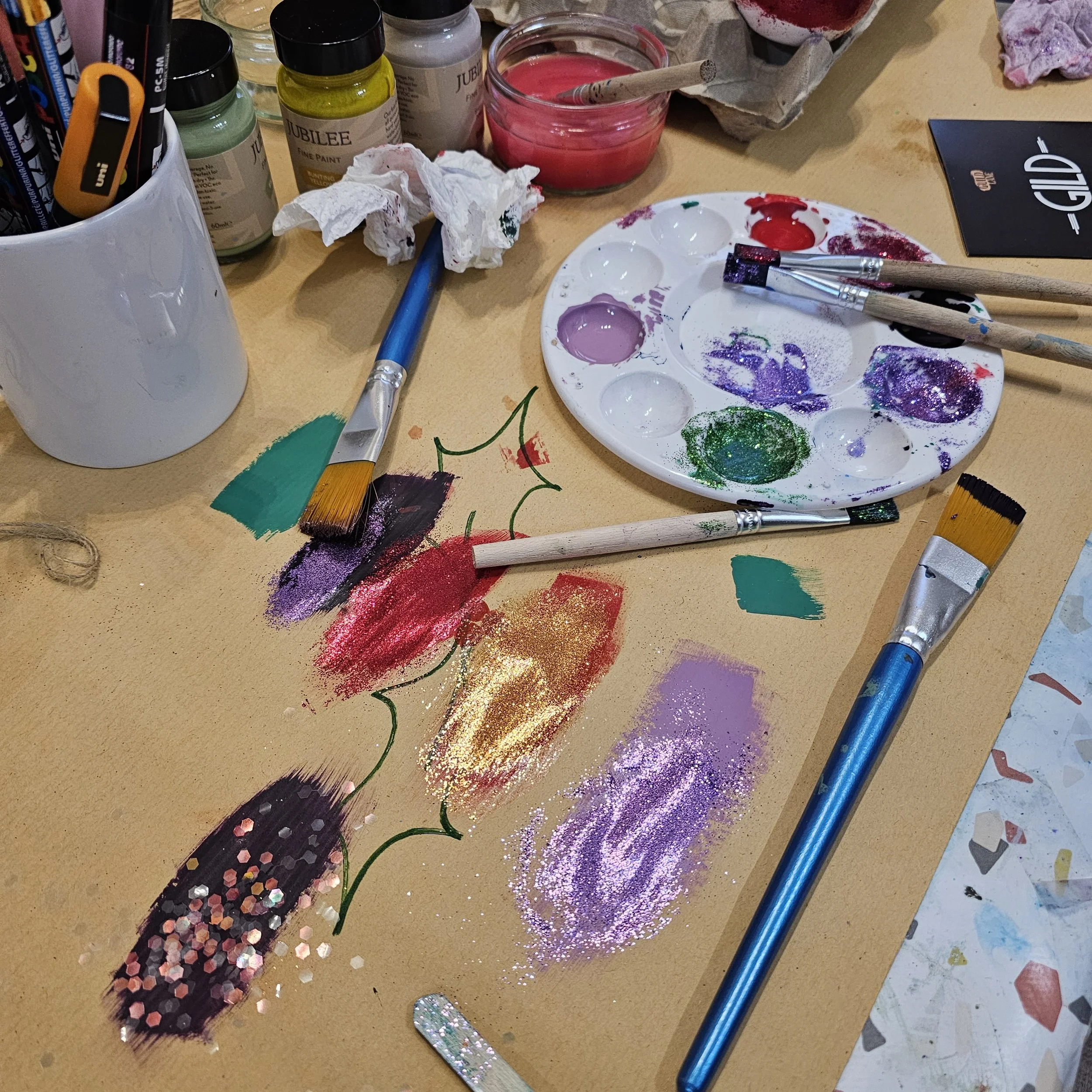 Christmas workshop paints and glitter.jpg