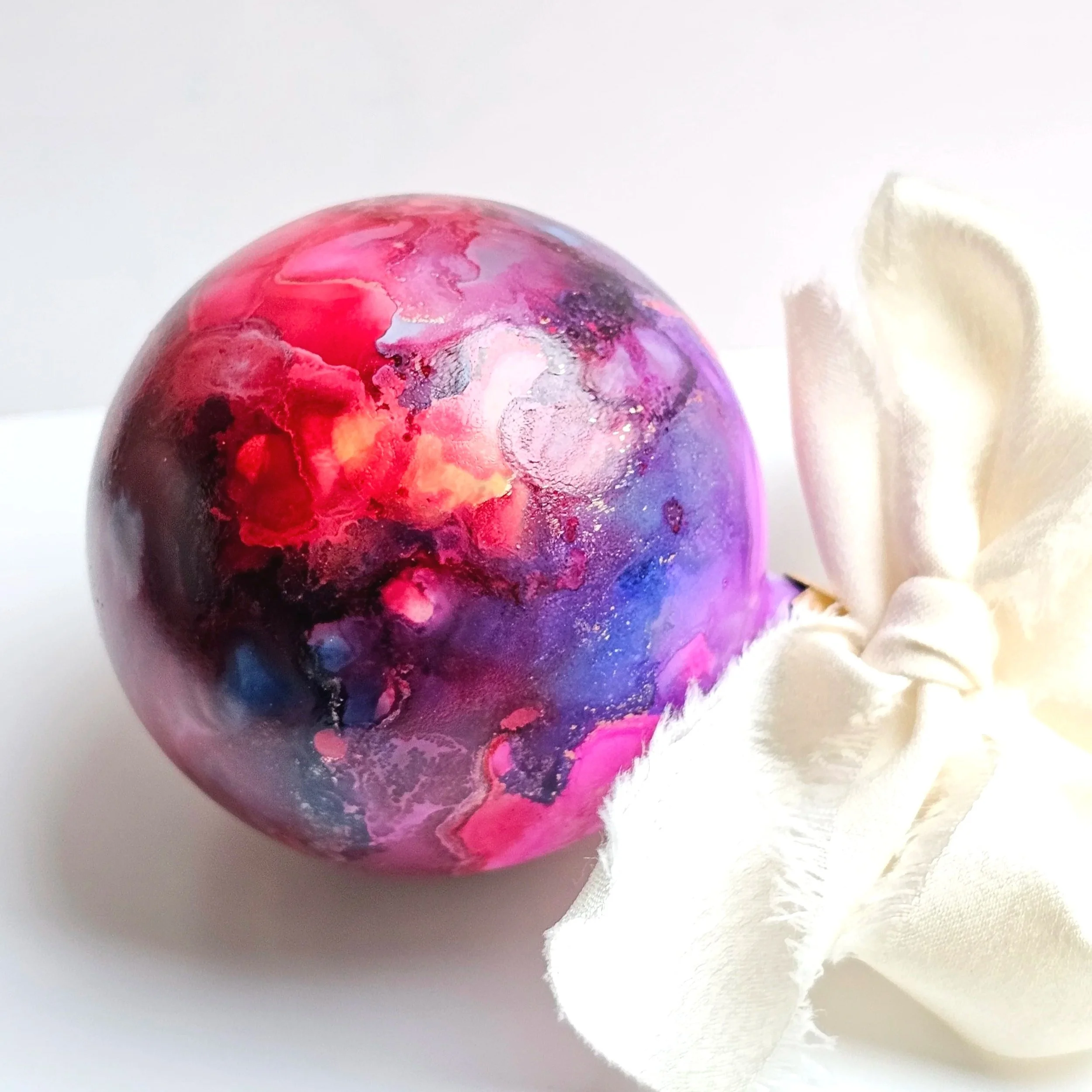 Galactic+Mist+pink+red+and+purple+bauble+with+white+ribbon.jpg