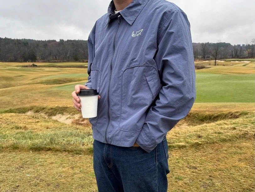 This all-weather layer flips from the perfect ocean blue to oyster grey. Lightweight, waterproof, and made for motion, it&rsquo;s built to handle sea spray, beer spills, and whatever the forecast forgot to mention.