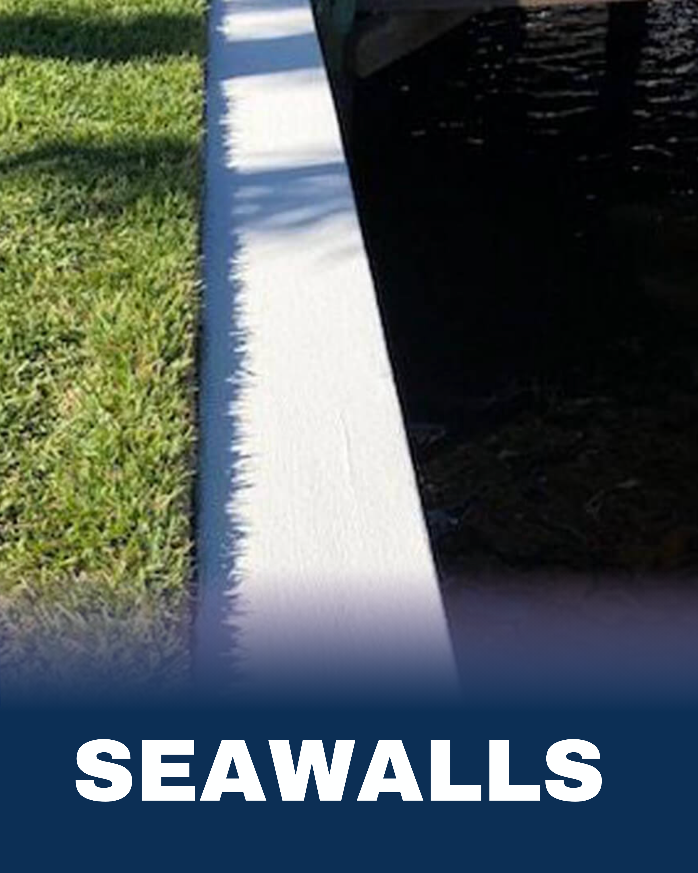Close-up of a white seawall next to a grassy area, with the word 'SEAWALLS' in bold white letters at the bottom.