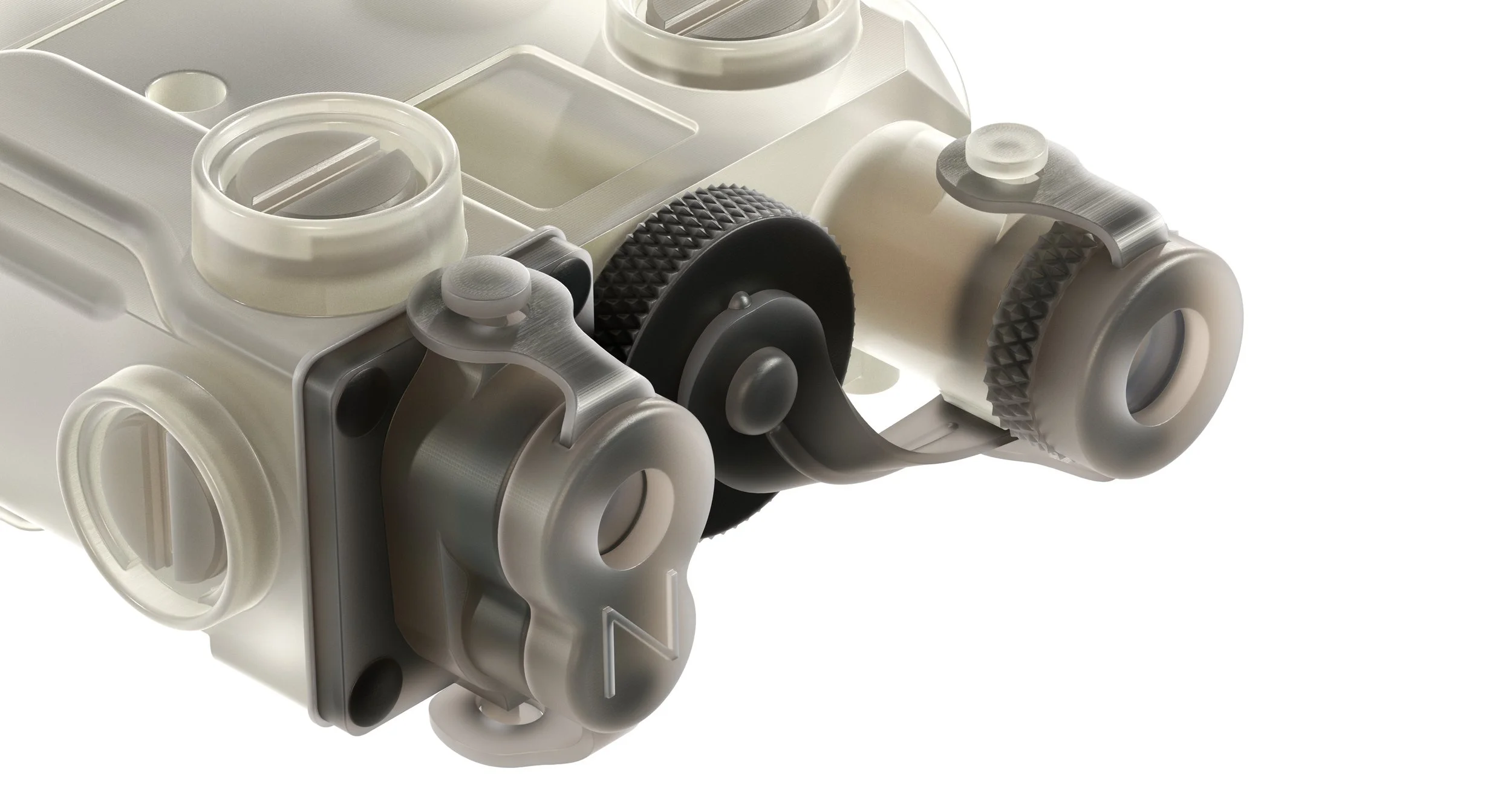 A close-up of a mechanical component with white and gray plastic parts and black textured gears.