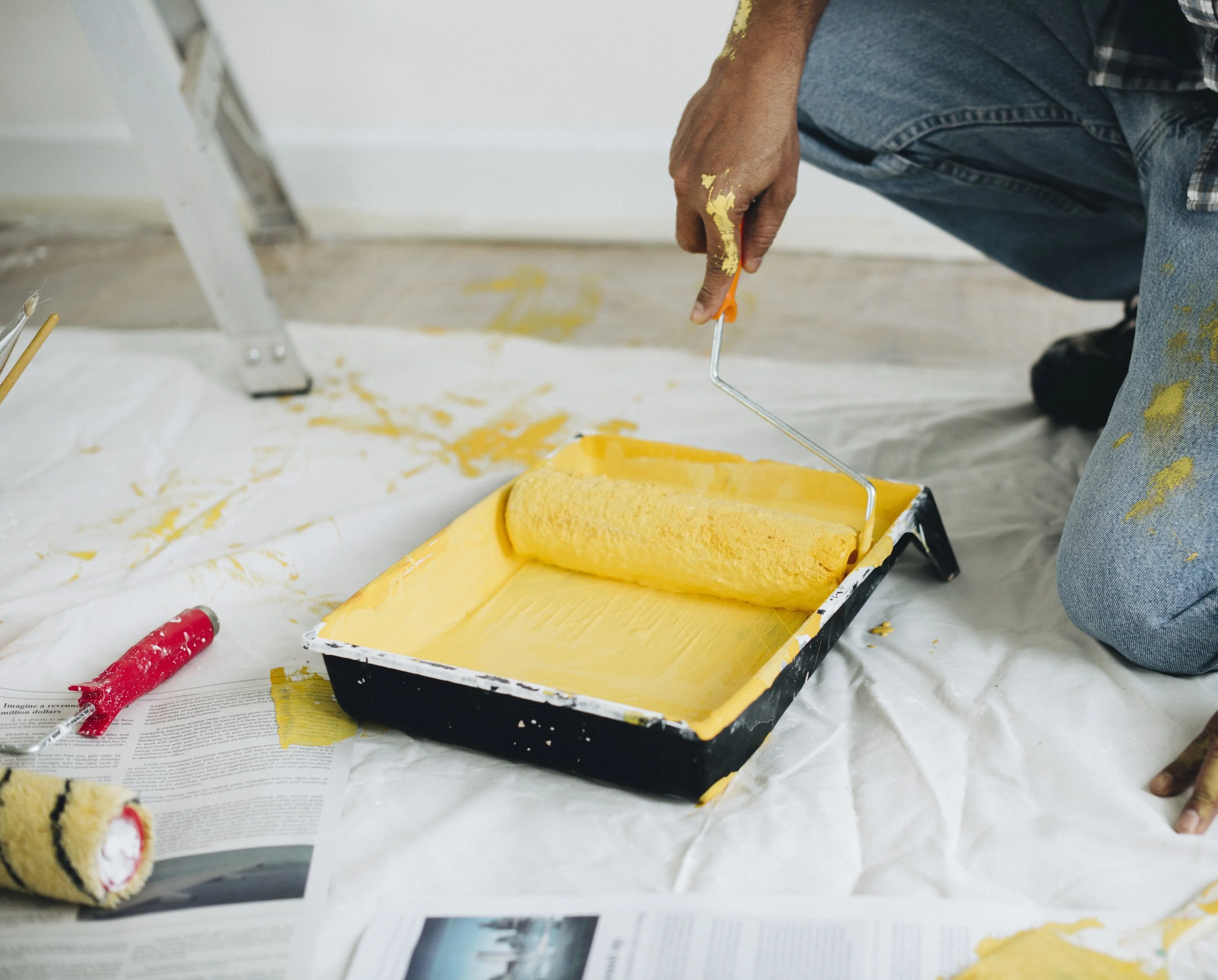 man-painting-walls-yellow.jpg