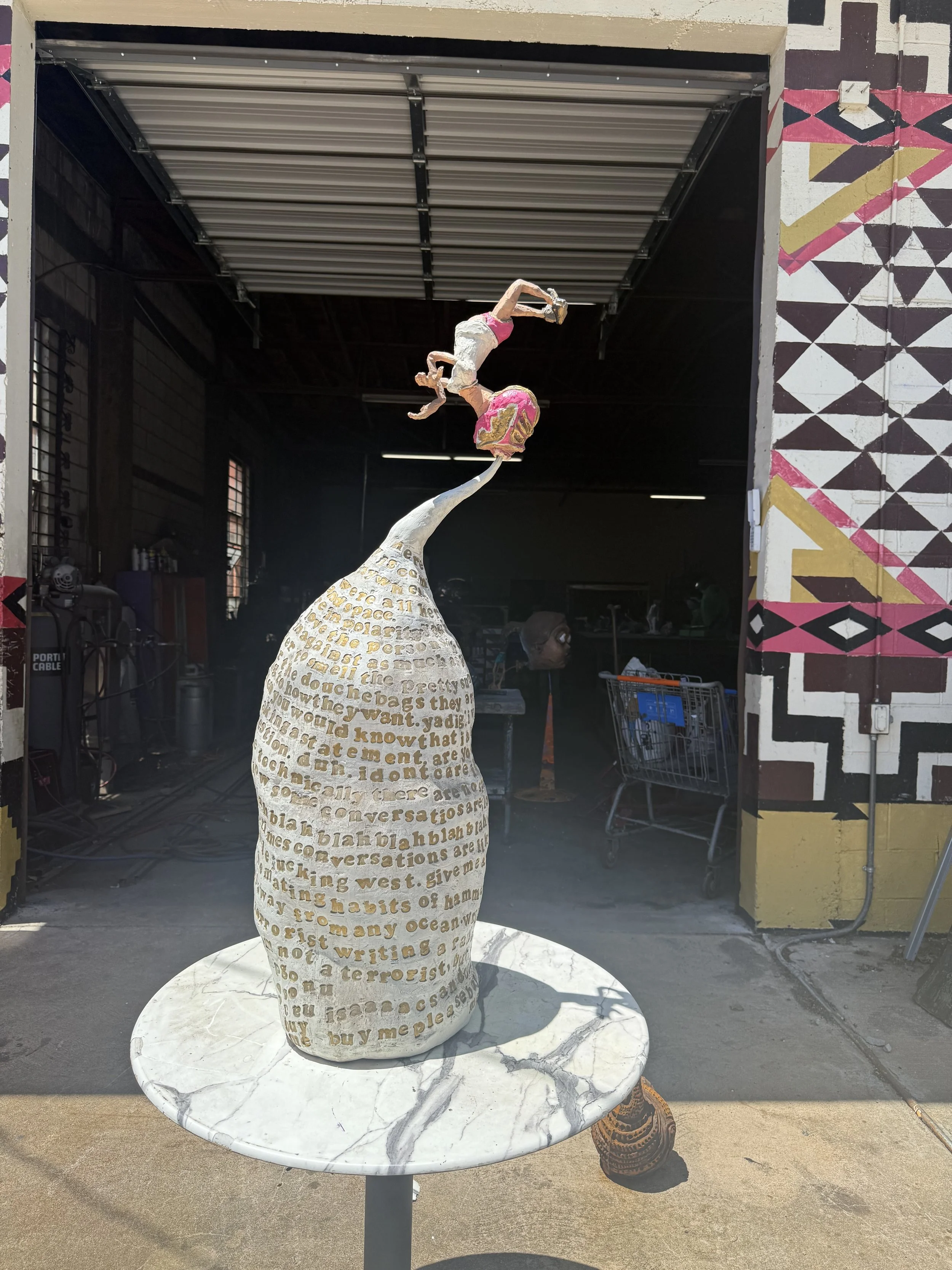 46 inch tall cast aluminum, ceramic, epoxy clay sculpture titled wrestling with the anxiety rambling