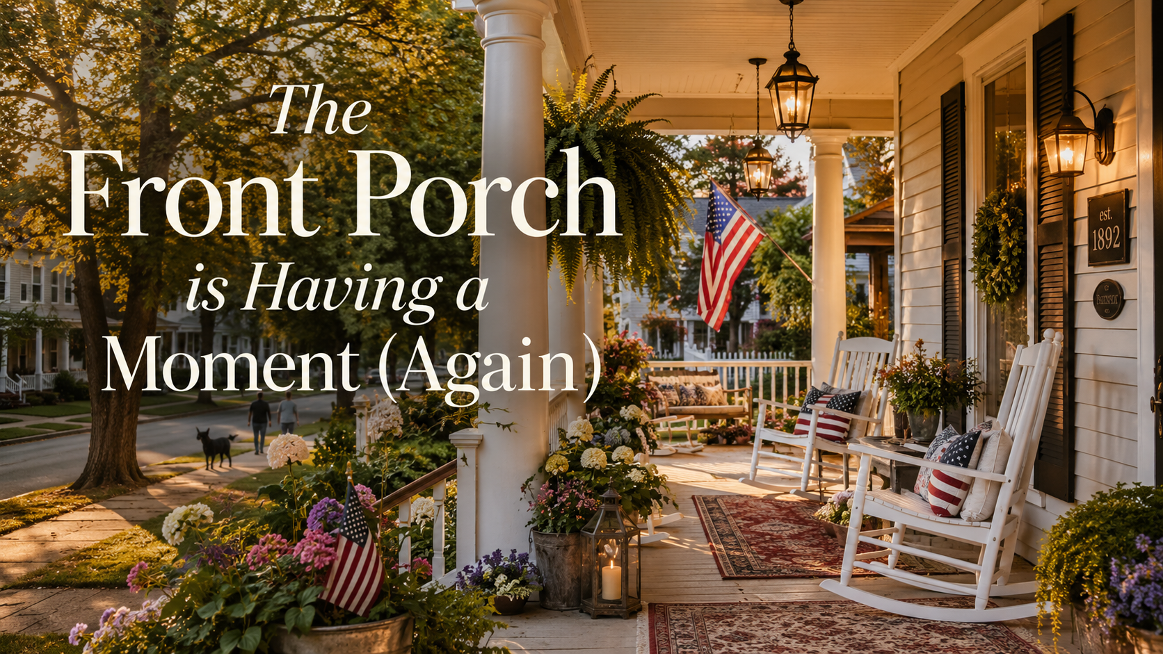 Historic American home with a welcoming front porch featuring white rocking chairs, hanging ferns, layered rugs, lanterns, blooming flowers, and an American flag at golden hour.