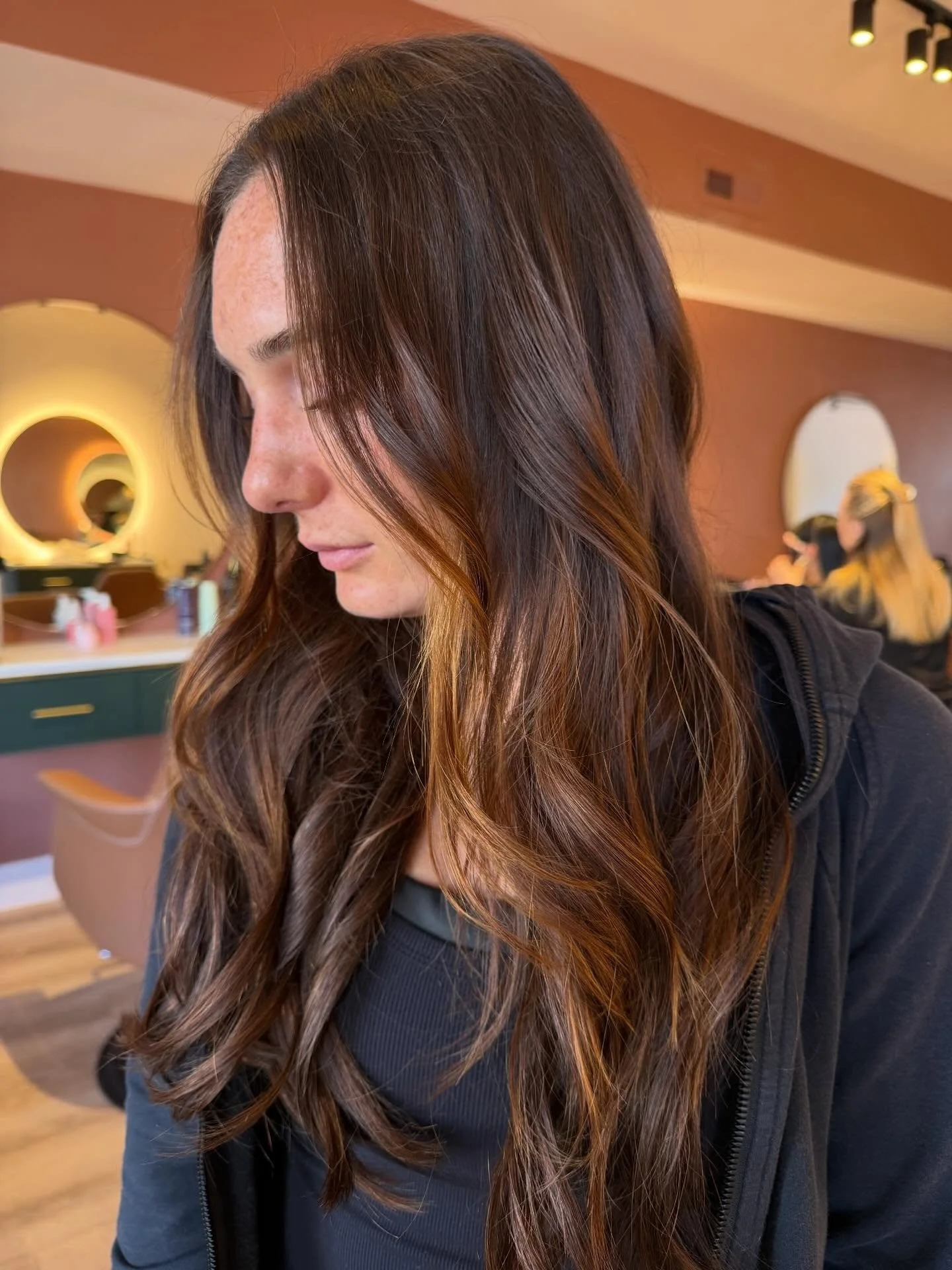 Dimensional brunette enhanced with tape in hair extensions.
