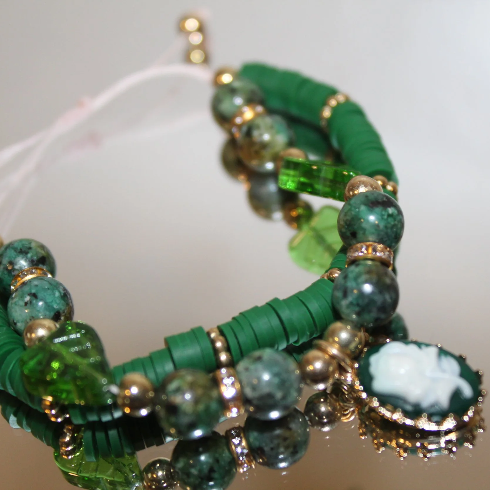 Emerald Muse Bracelet – Handcrafted Green Stone & Cameo Charm Bracelet
