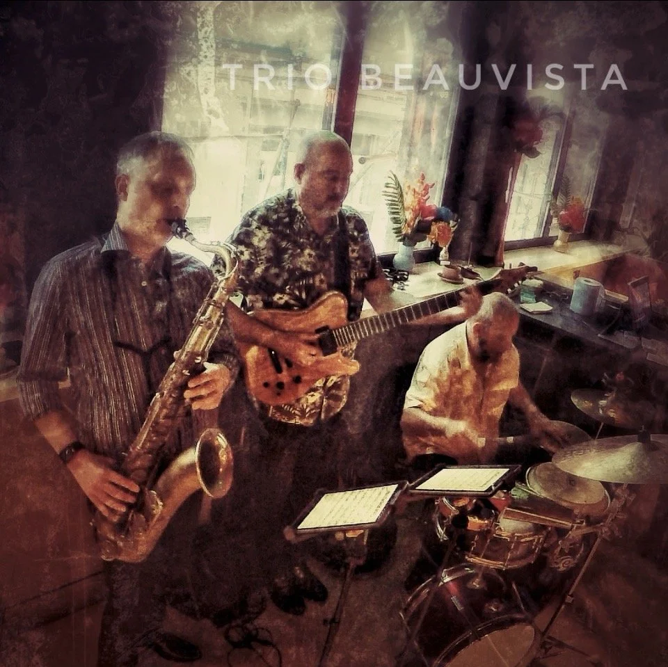 Three musicians performing indoors: a saxophonist, a guitarist, and a drummer, with a window and decorative vases in the background.