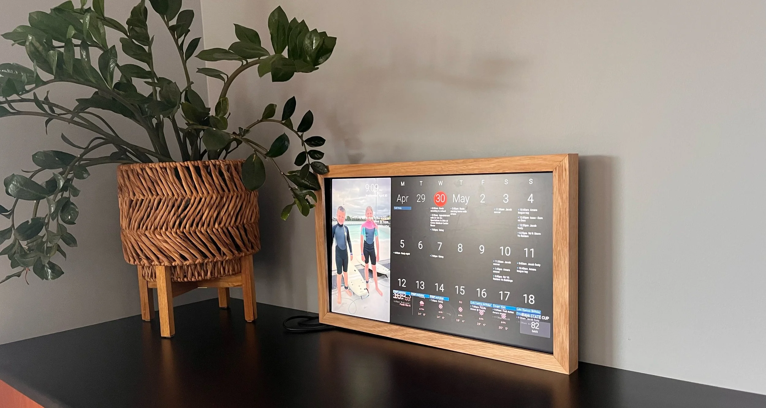 Laurie’s customers, Mariana and Carmen holding hands on a green lawn on their wedding day.