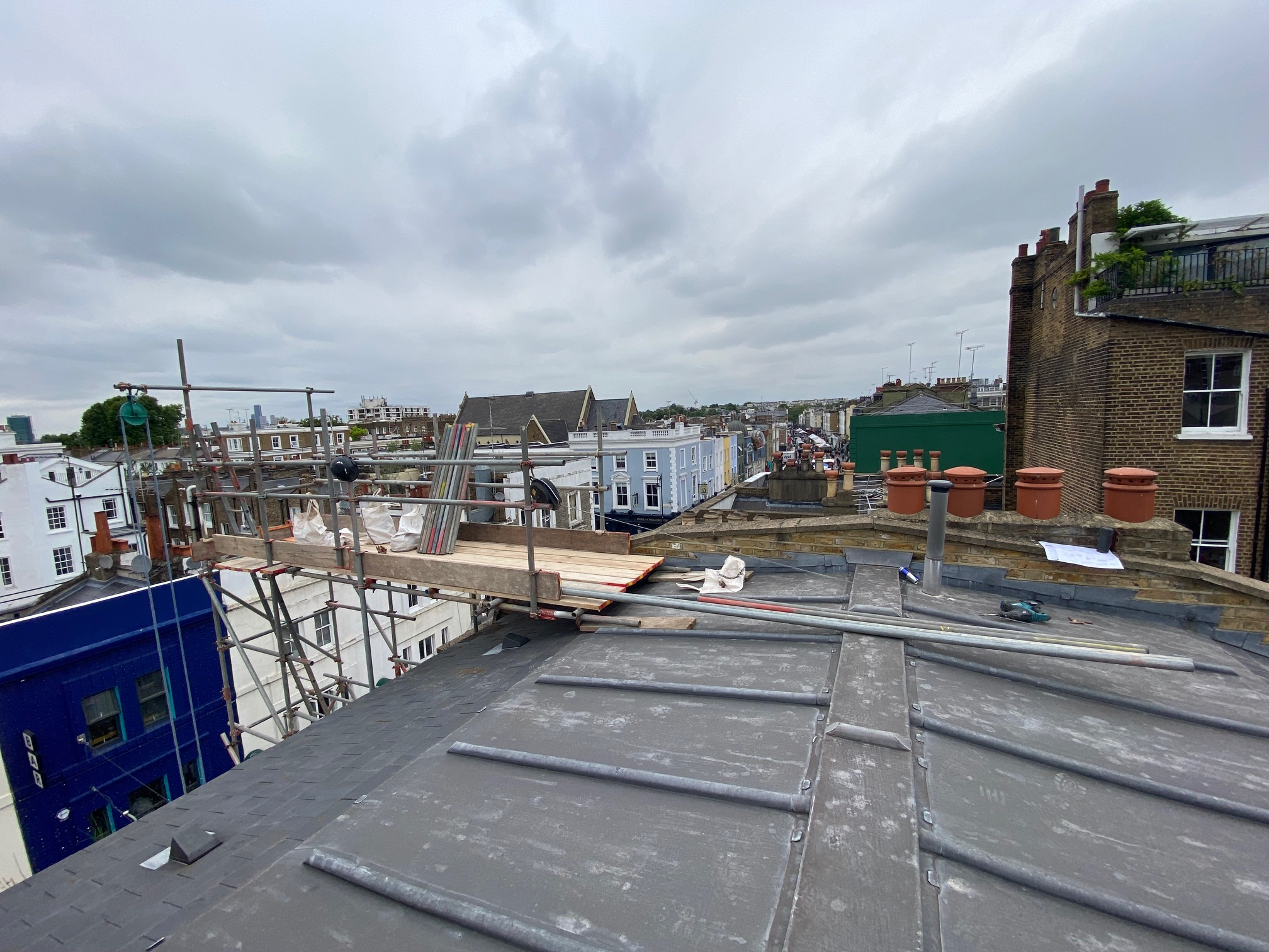 Tower scaffold built to front of property on Portobello Road, view across roof to where the rooflight AOV will be built. Homebuilding Essentials
