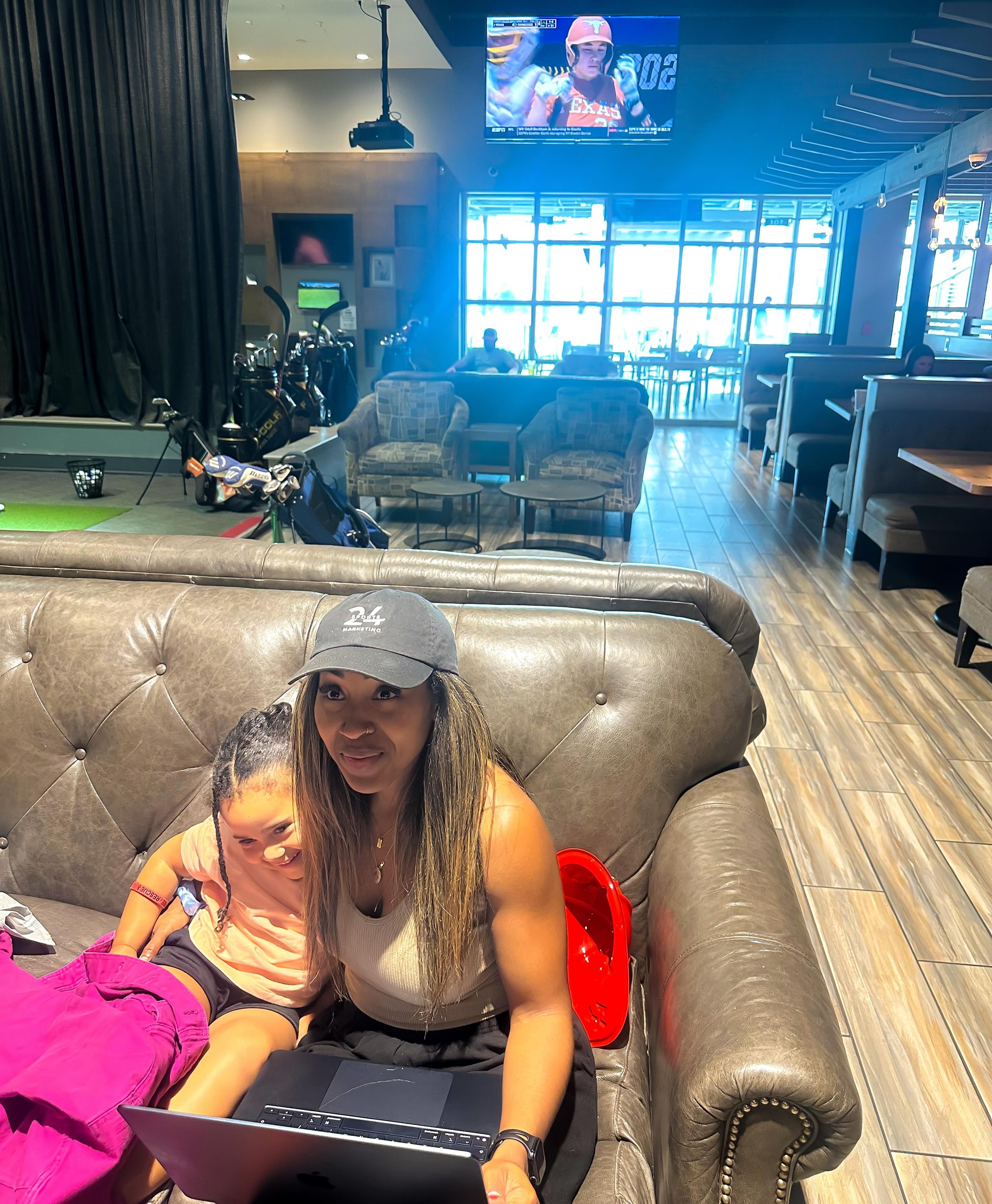 Work mode, mom mode, #WCWS mode. Sometimes the office looks like this. Who else is tuned in?! 👀🥎