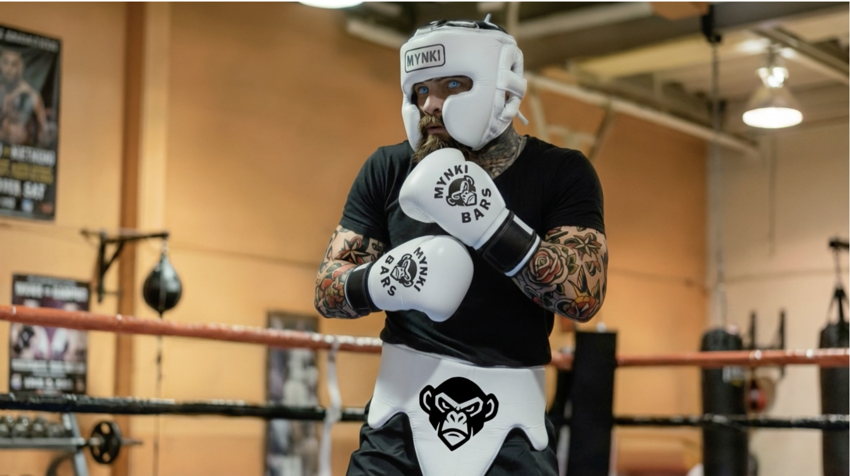 Boxer wearing Mynki Bars Layers executing controlled striking under monitored conditions, representing real-time performance capture and system feedback.