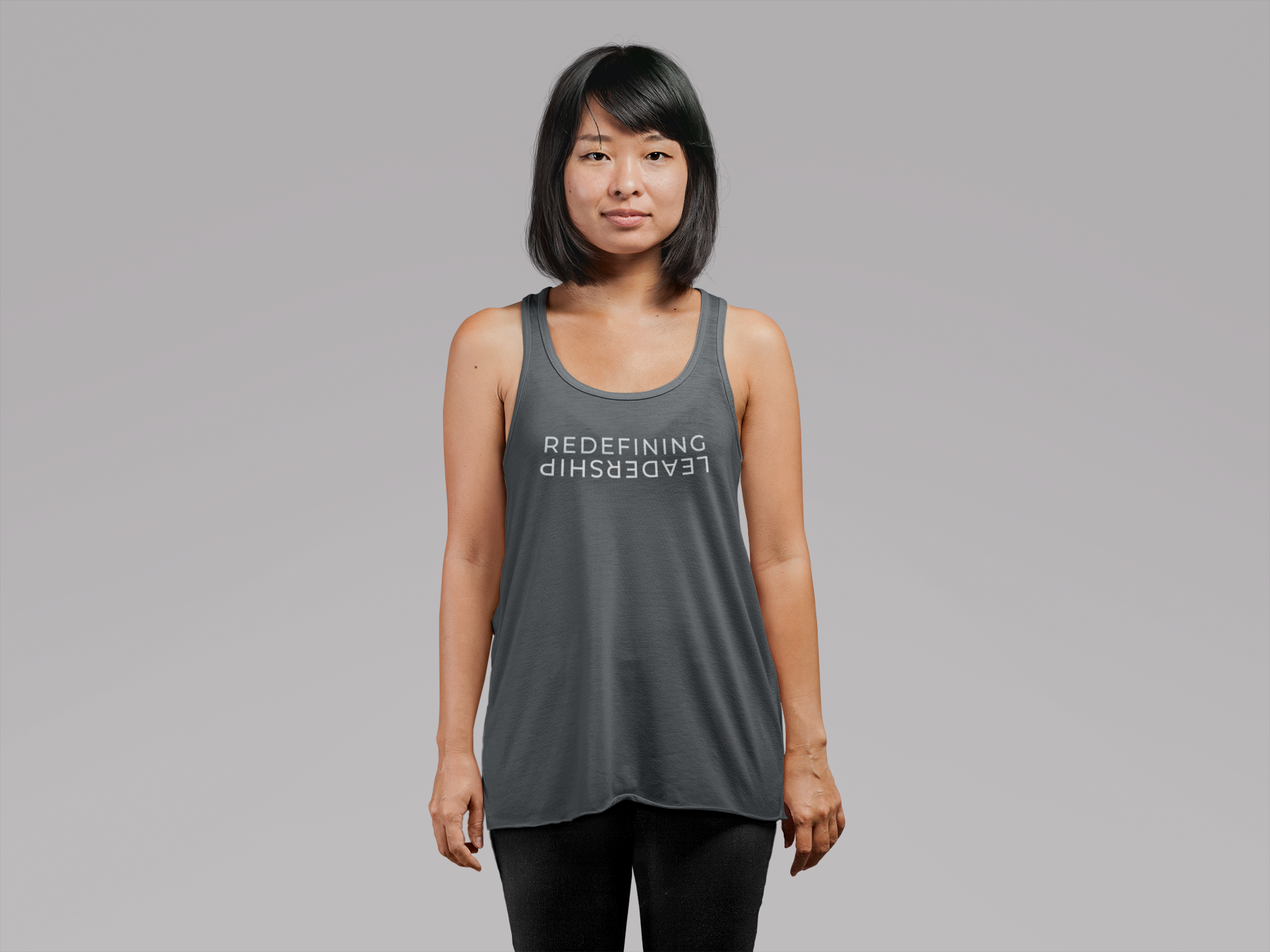 mockup-of-a-young-woman-wearing-a-loose-tank-top-at-a-studio-21732.png