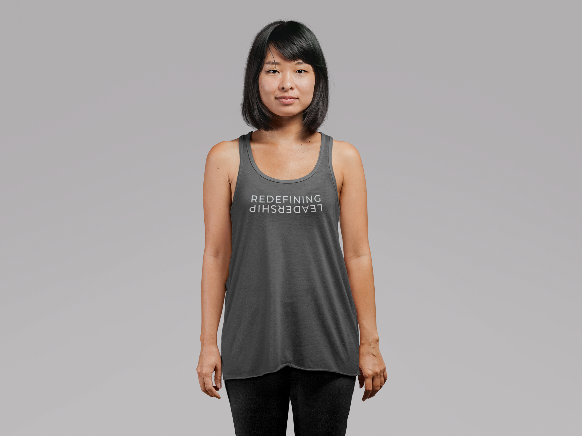 mockup-of-a-young-woman-wearing-a-loose-tank-top-at-a-studio-21732 (1).png