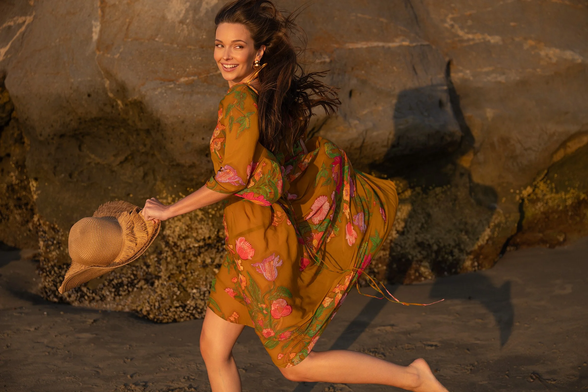 A woman in a floral dress. Photography by Kelly Fajack. Best photographer in Los Angeles. Capturing travel, fashion, and advertising. Fashion in Los Angeles. Fashion, resort, luxury lifestyle photographer.