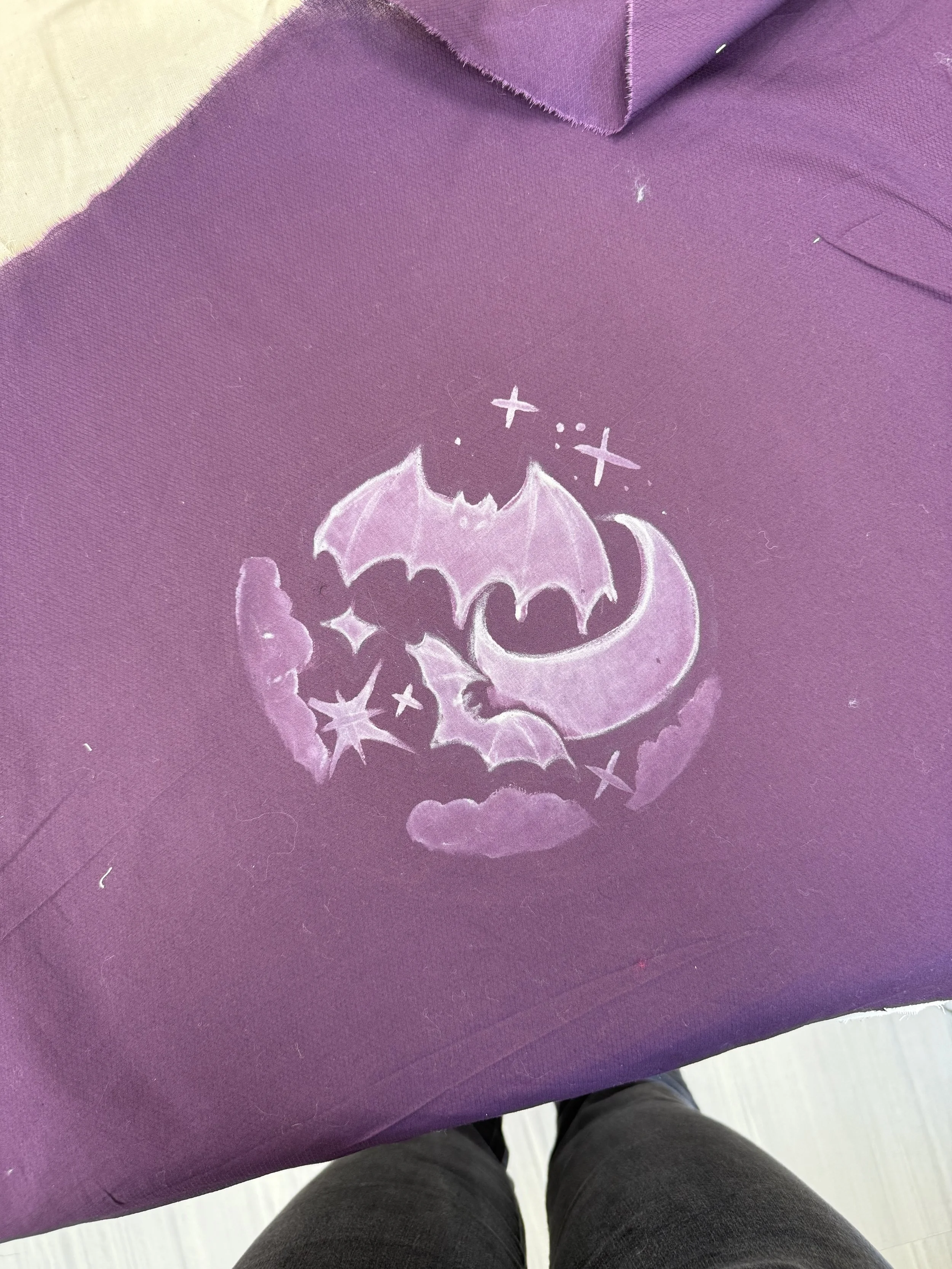 I drew these bats onto a piece of cotton fabric using a white pencil. I then used Decolorant to give it this white look.
