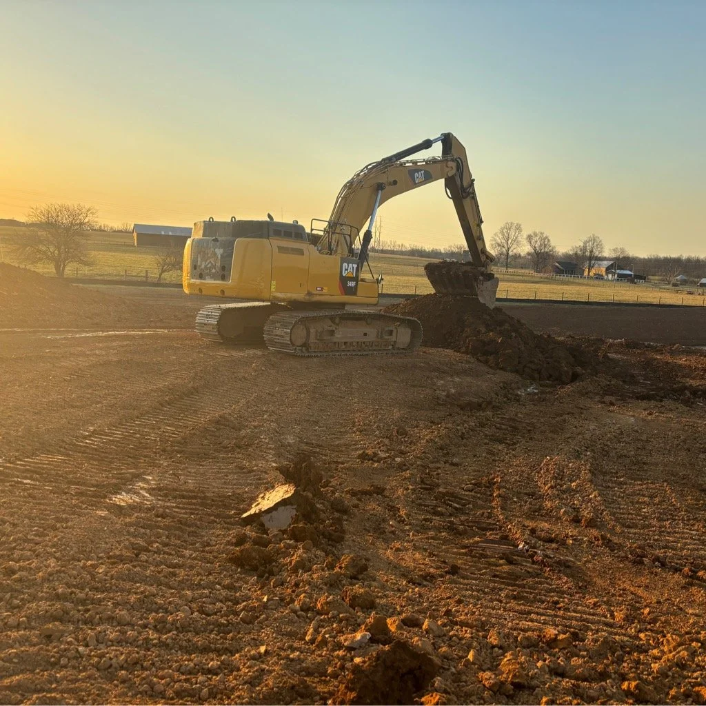 excavator moving dirt at Limestone Distillery