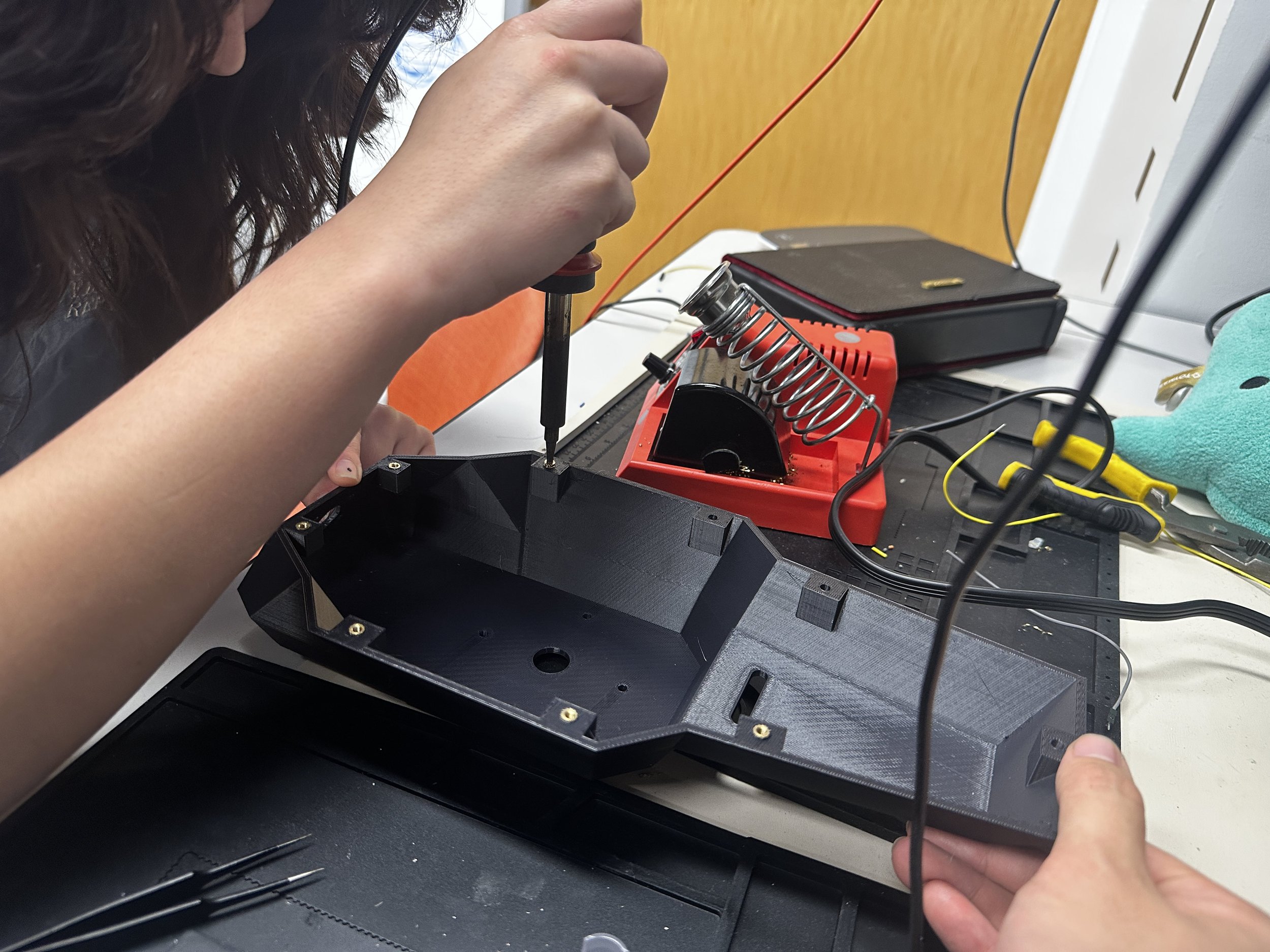  Inserting heat set inserts to upper drone shell 