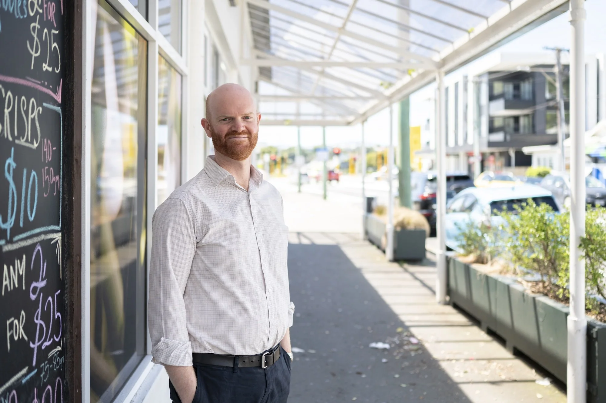 Jonny Osborne standing outside shops in Kilbirnie