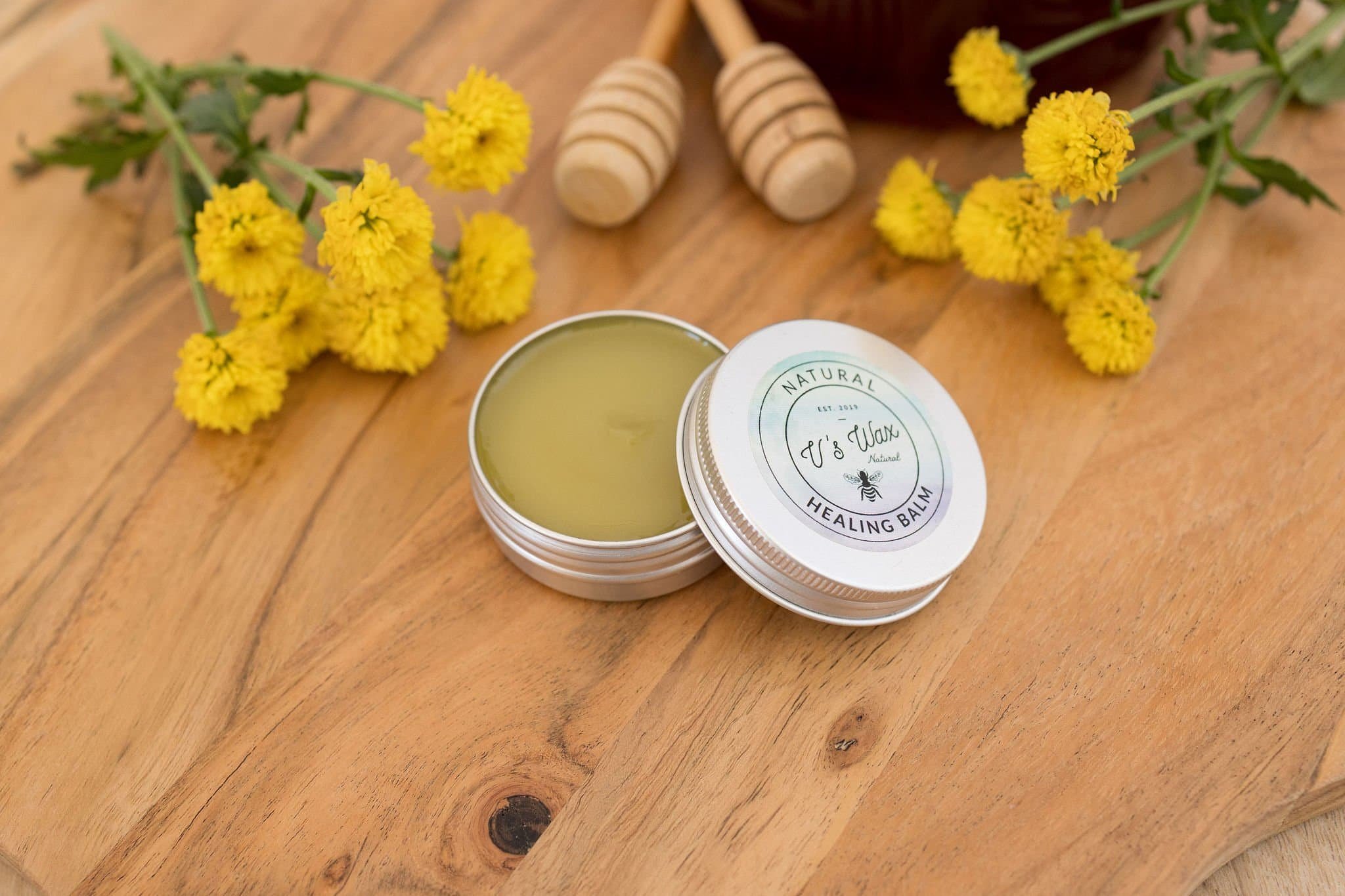 V's Wax Natural Healing Balm jar displayed on a neutral background