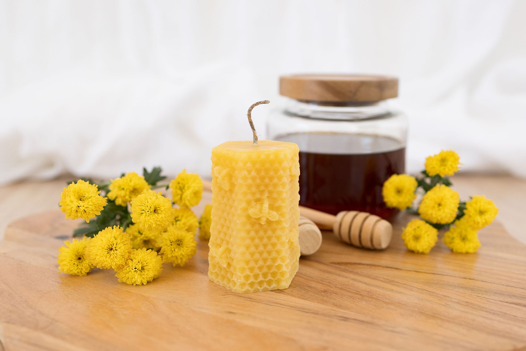 Handmade beeswax candle with bee design and raw hemp wick, natural eco-luxury gift