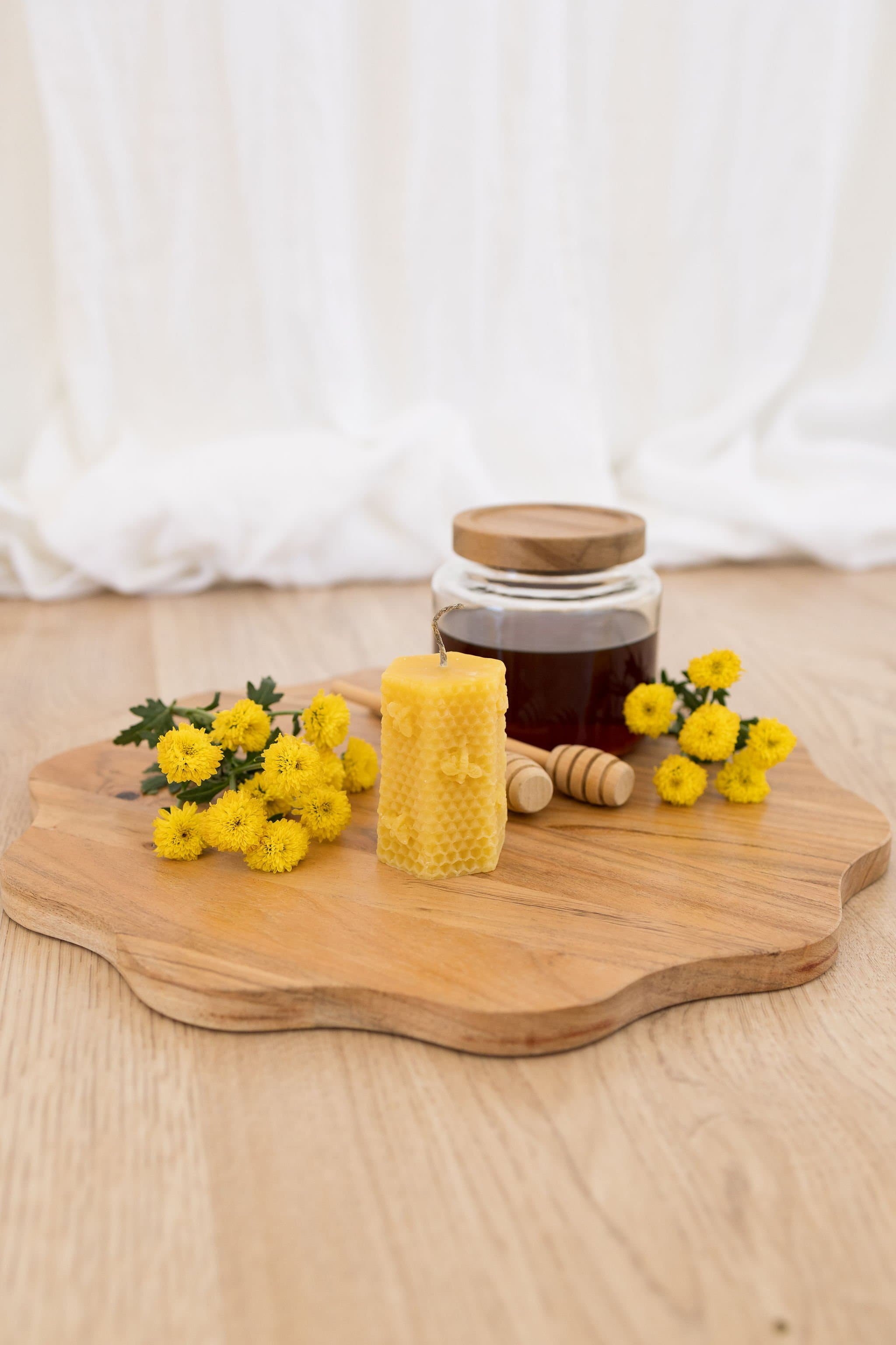 Handmade beeswax candle with bee design and raw hemp wick, natural eco-luxury gift