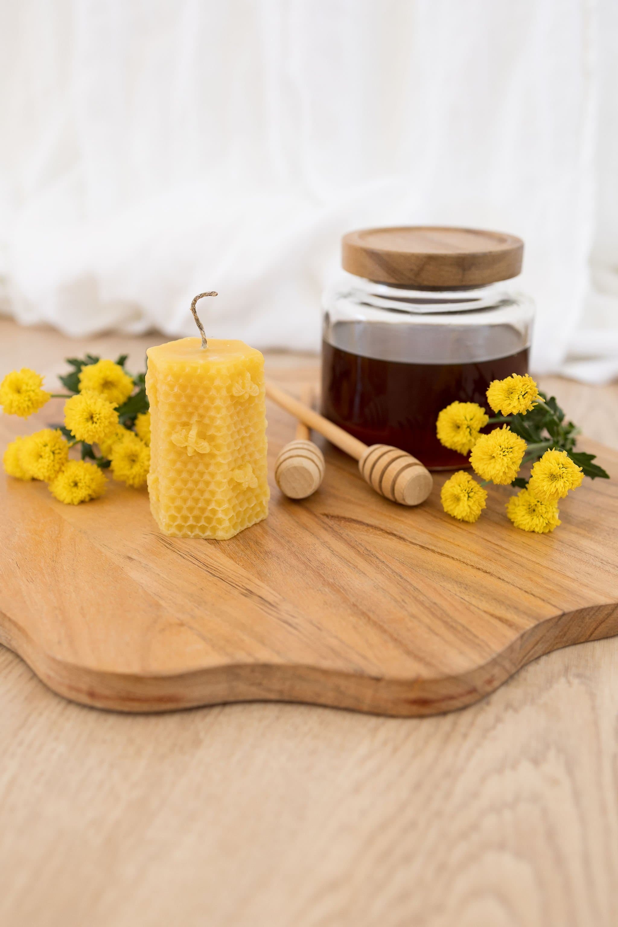 Handmade beeswax candle with bee design and raw hemp wick, natural eco-luxury gift