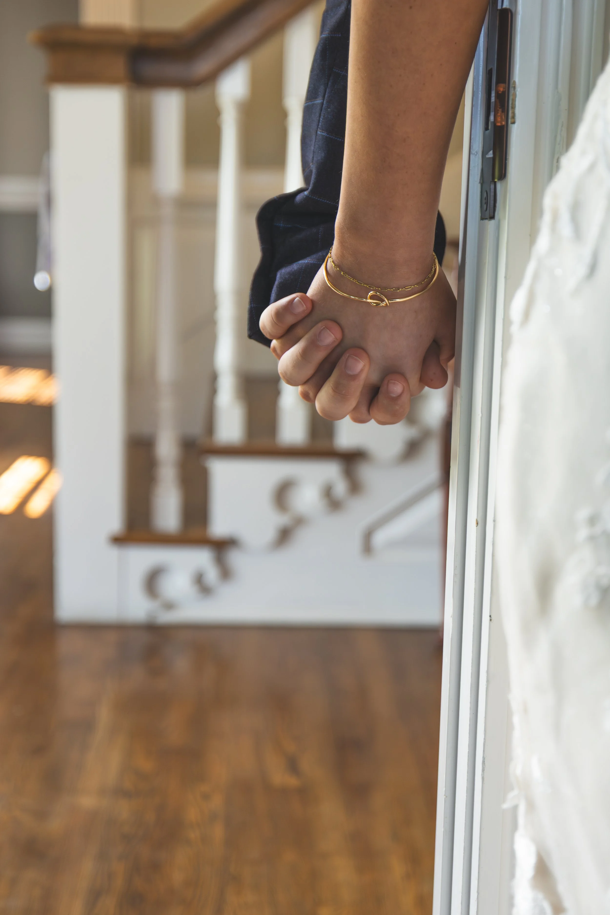 mildale-farm-bride-groom-hands-first-touch.jpg